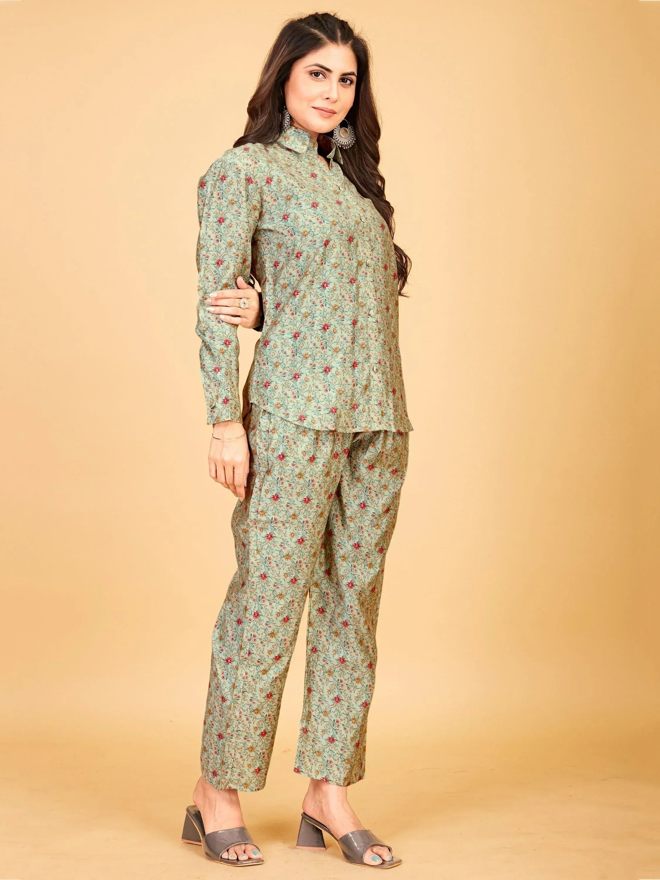 Floral print salwar kameez set in mint green with red accents, stylish ethnic wear for women