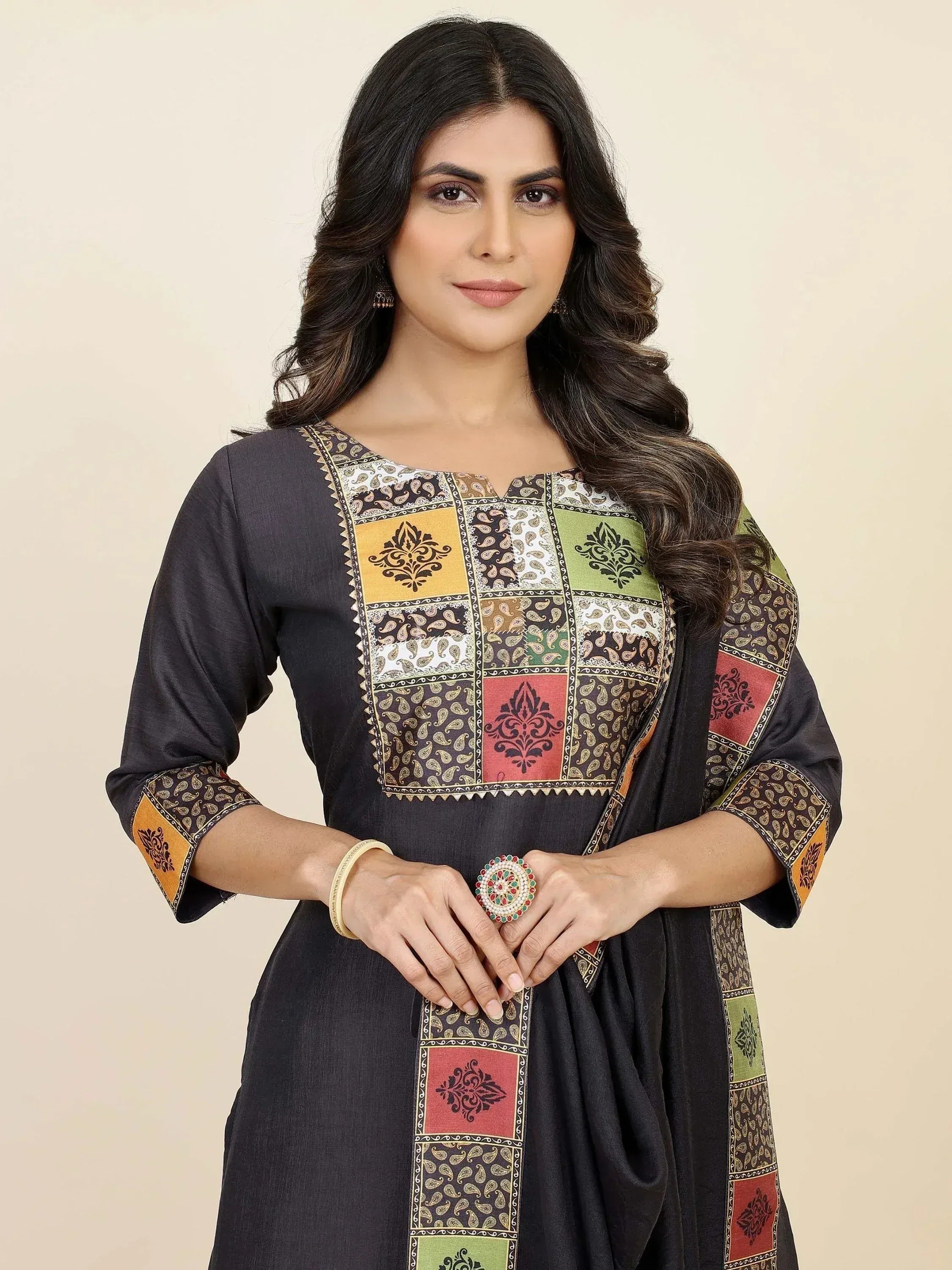 Black ethnic kurti with colorful patchwork and paisley print, perfect for Indian wear