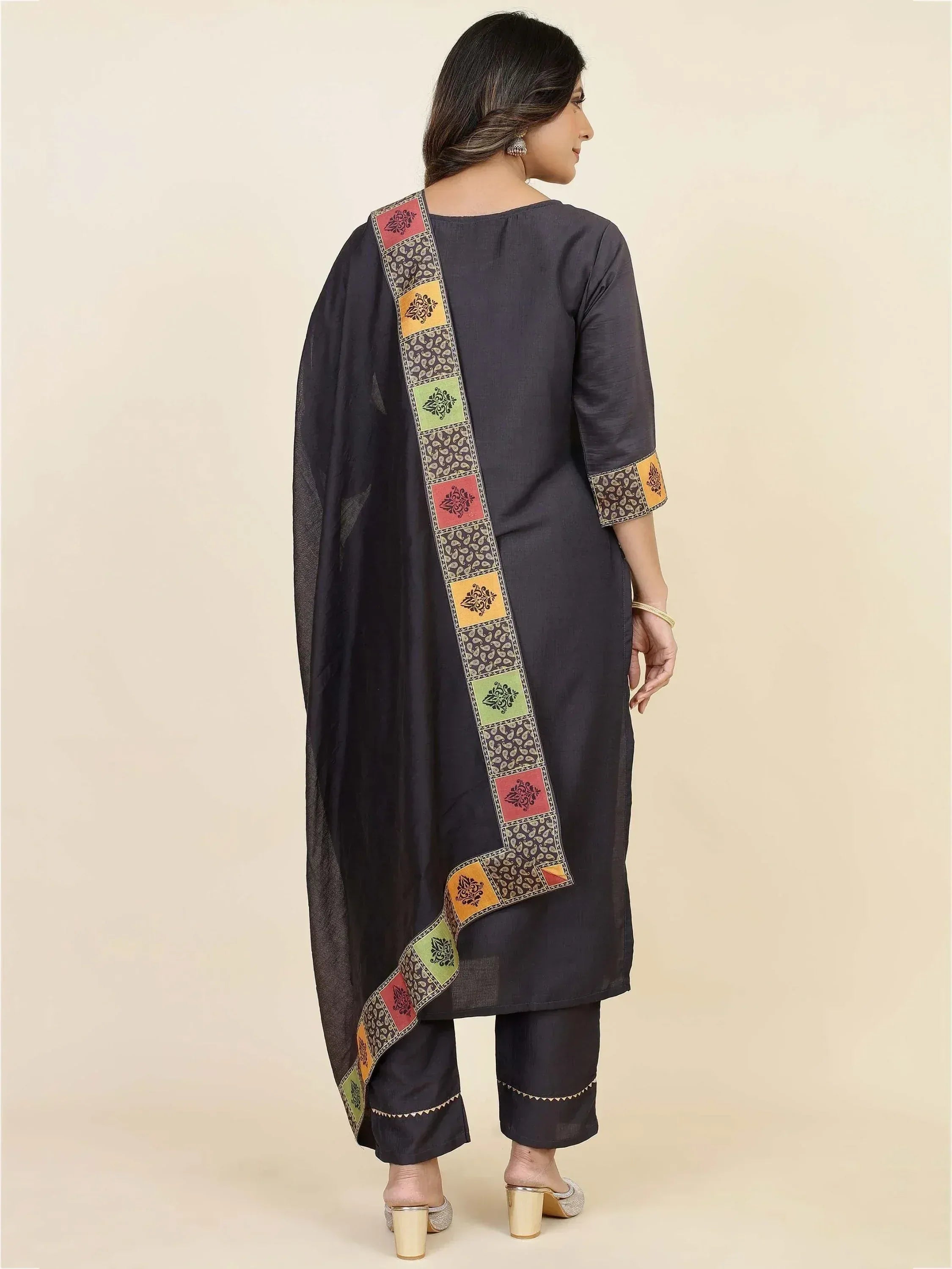 Black ethnic salwar kameez with colorful patchwork dupatta and embroidered details