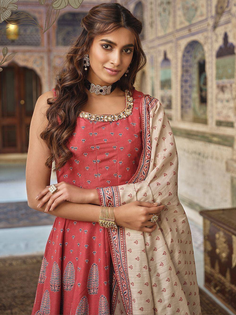 Red printed anarkali with embroidered neckline and matching dupatta, styled with traditional jewelry