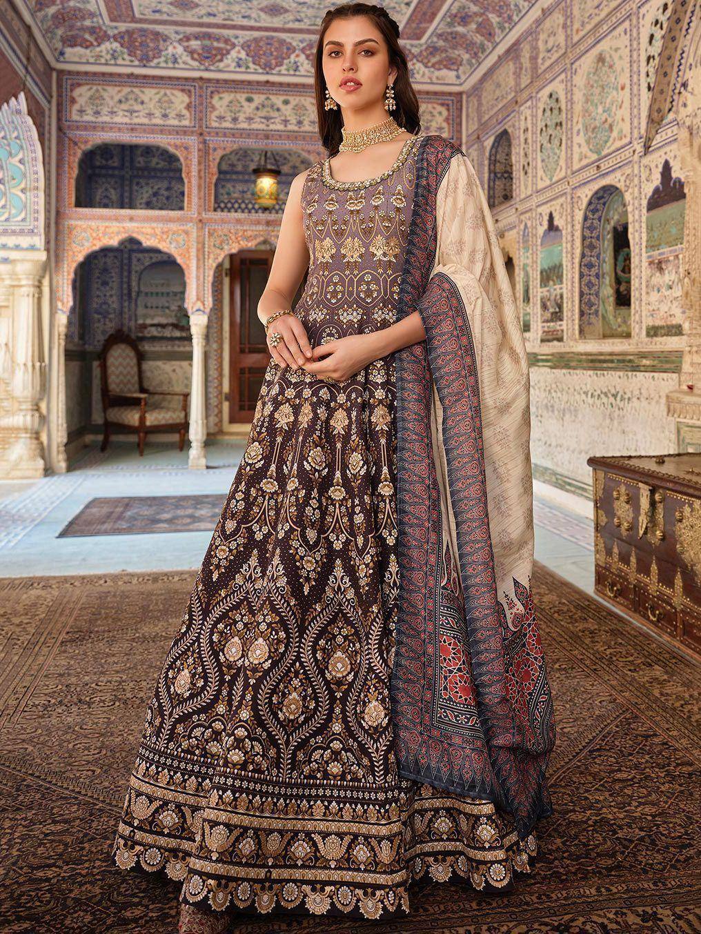 Elegant brown embroidered lehenga choli with gold detailing, paired with patterned dupatta, perfect for Indian ethnic occasions.