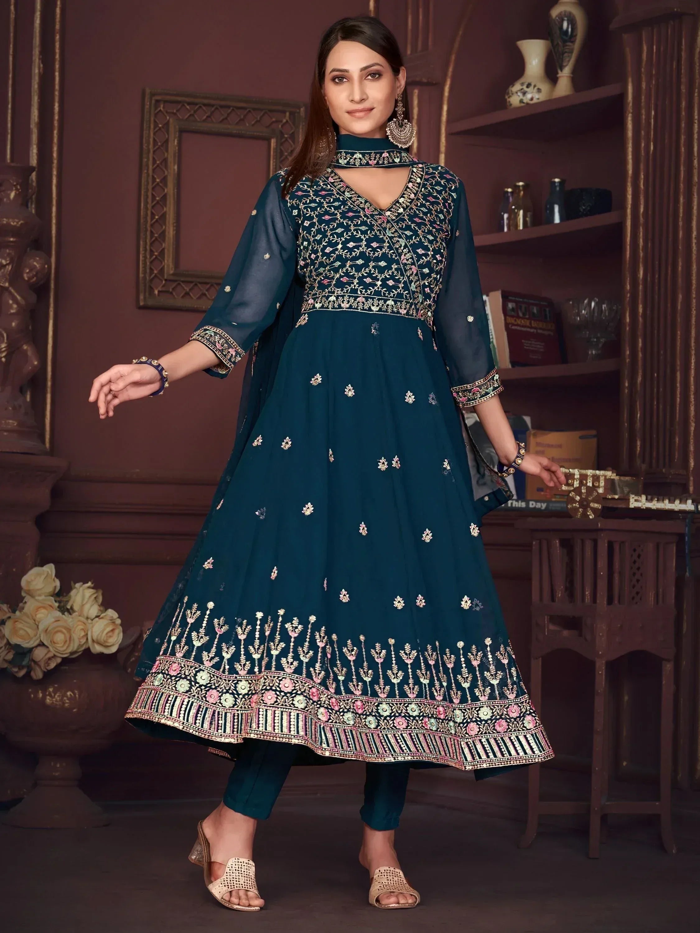 Teal embroidered anarkali suit with floral detailing, perfect for Indian ethnic wear occasions.