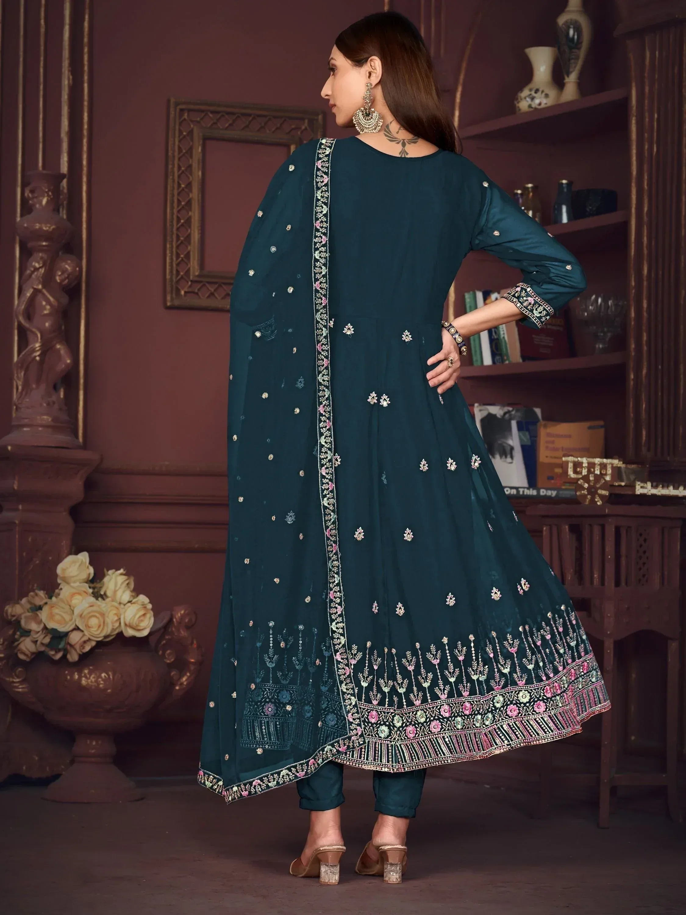 Teal embroidered salwar kameez with floral detailing, perfect for ethnic occasions and Indian wear.
