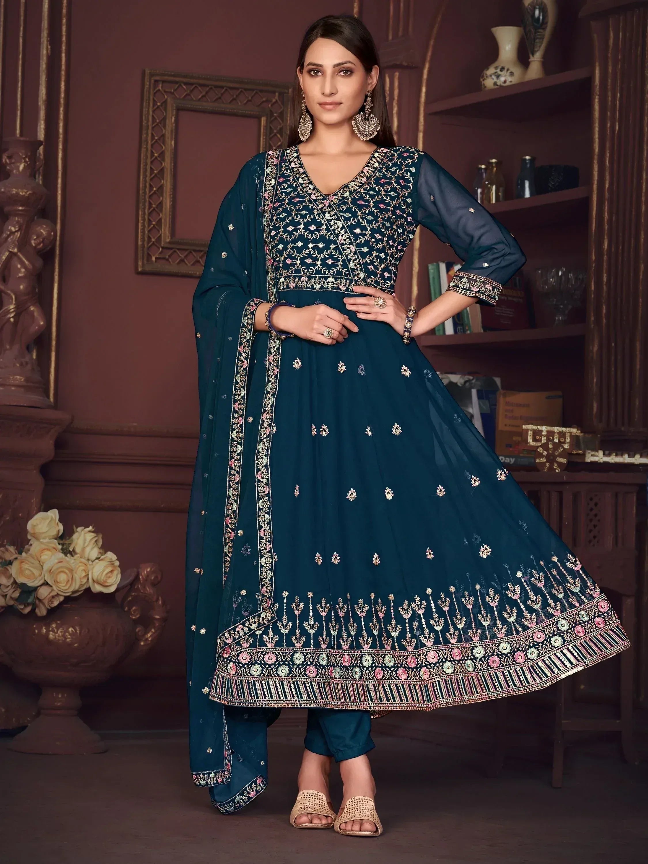 Elegant teal designer anarkali suit with intricate embroidery and matching dupatta for Indian ethnic wear.