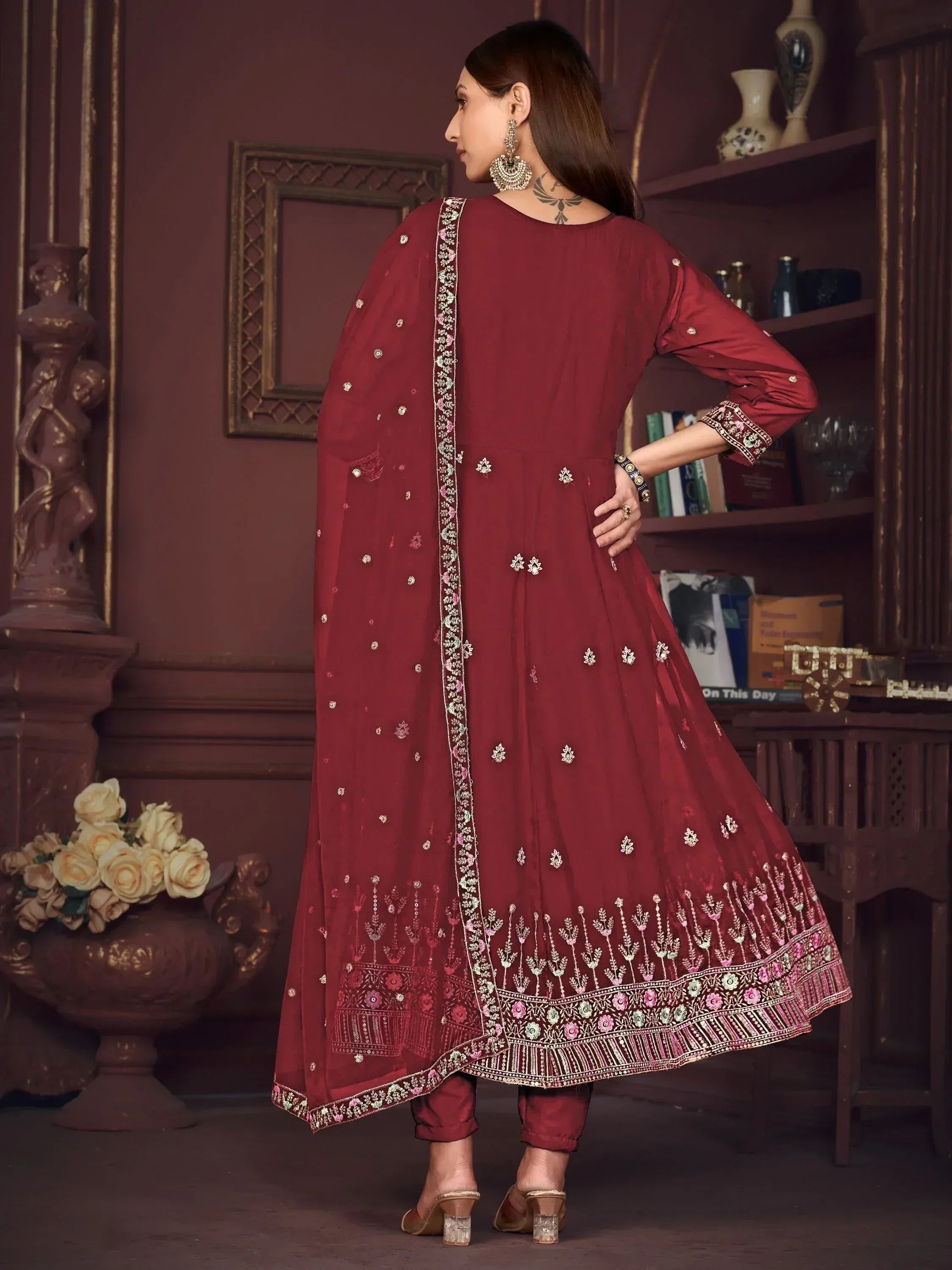 Maroon embroidered anarkali suit with floral detailing and matching dupatta, perfect for ethnic occasions.