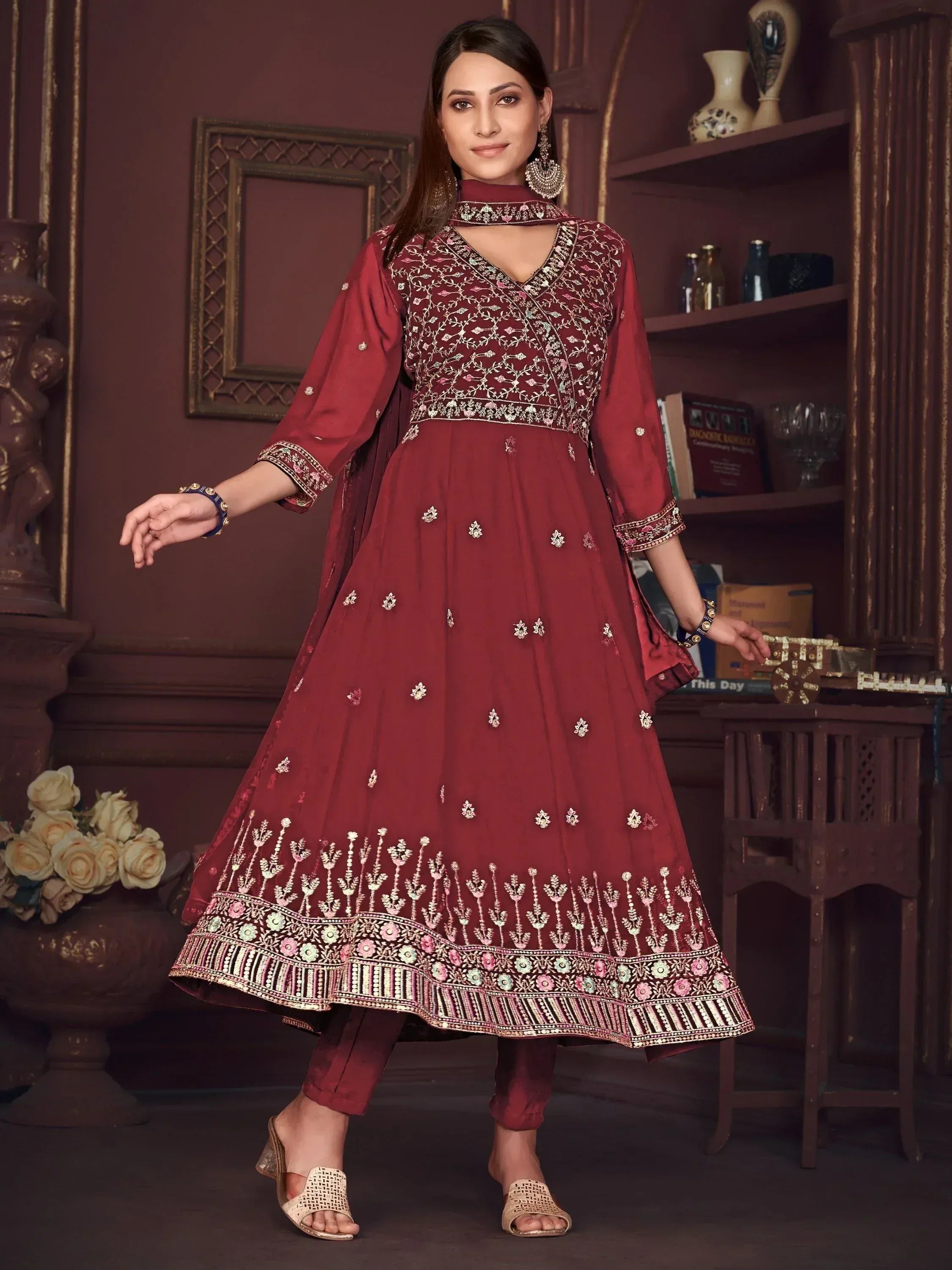 Maroon embroidered anarkali suit with floral detailing and matching pants, perfect for Indian ethnic wear.