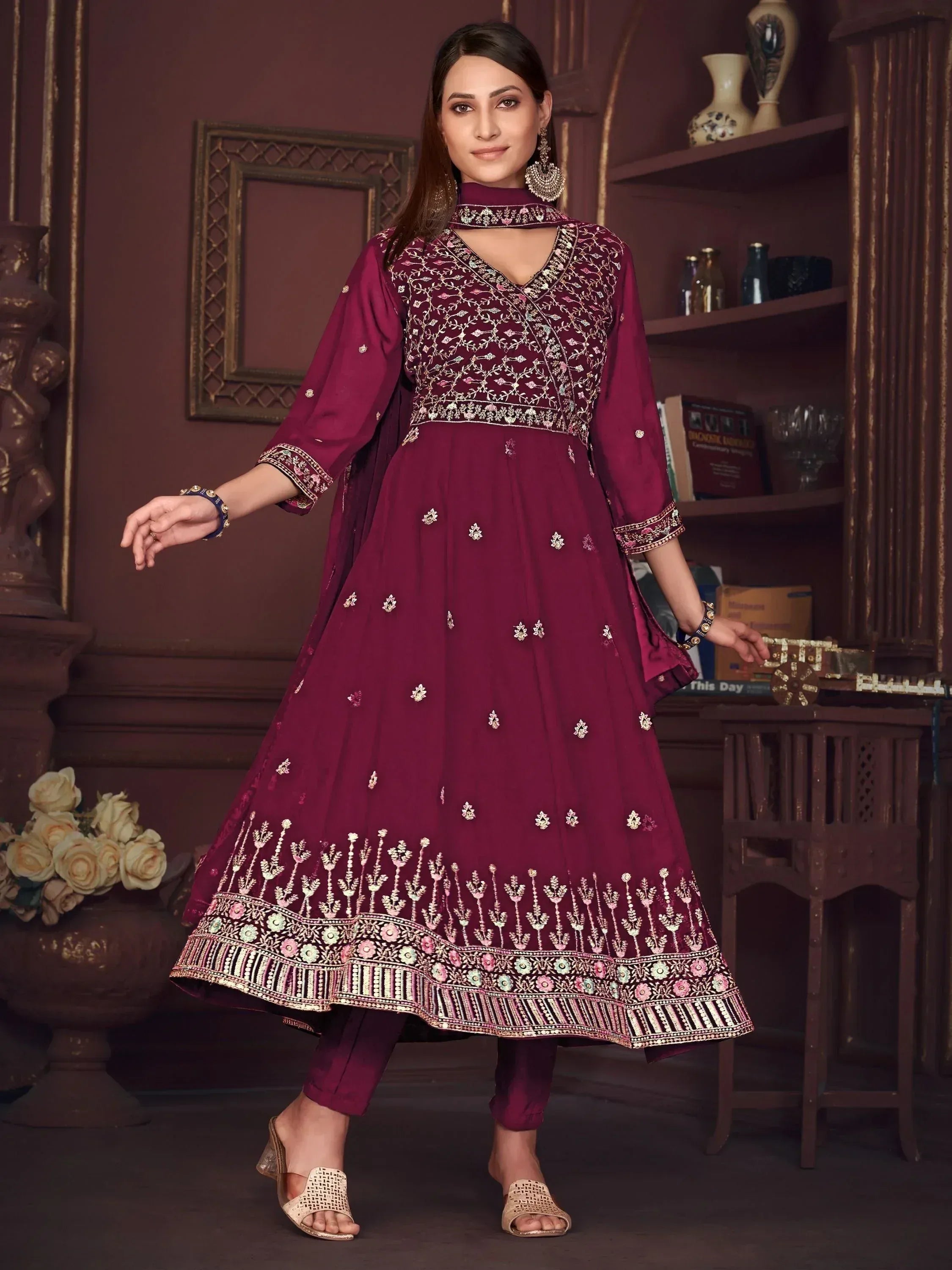 Maroon embroidered anarkali suit with floral motifs, perfect for Indian ethnic wear occasions.