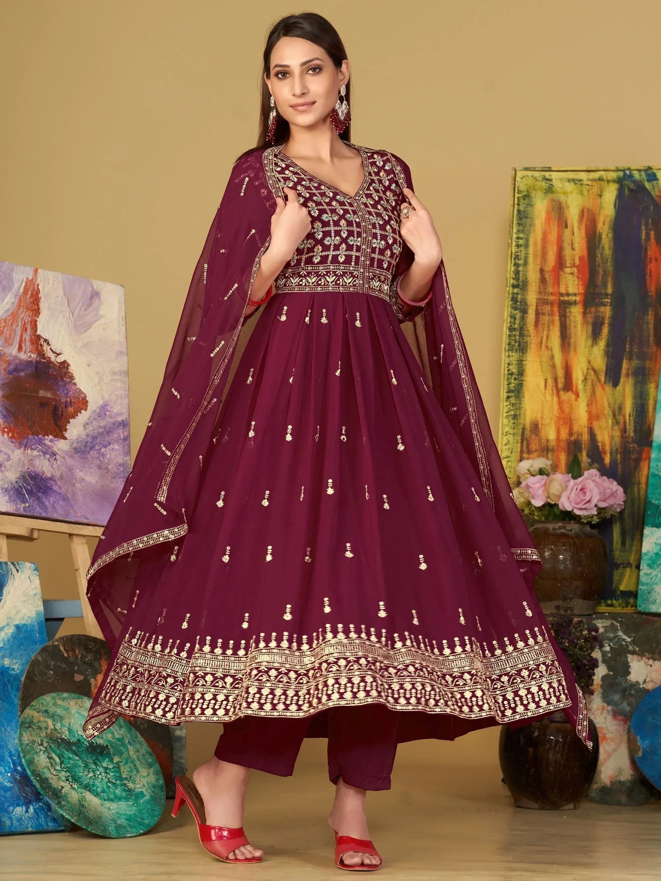 Elegant maroon anarkali suit with gold embroidery, perfect for Indian ethnic wear occasions.