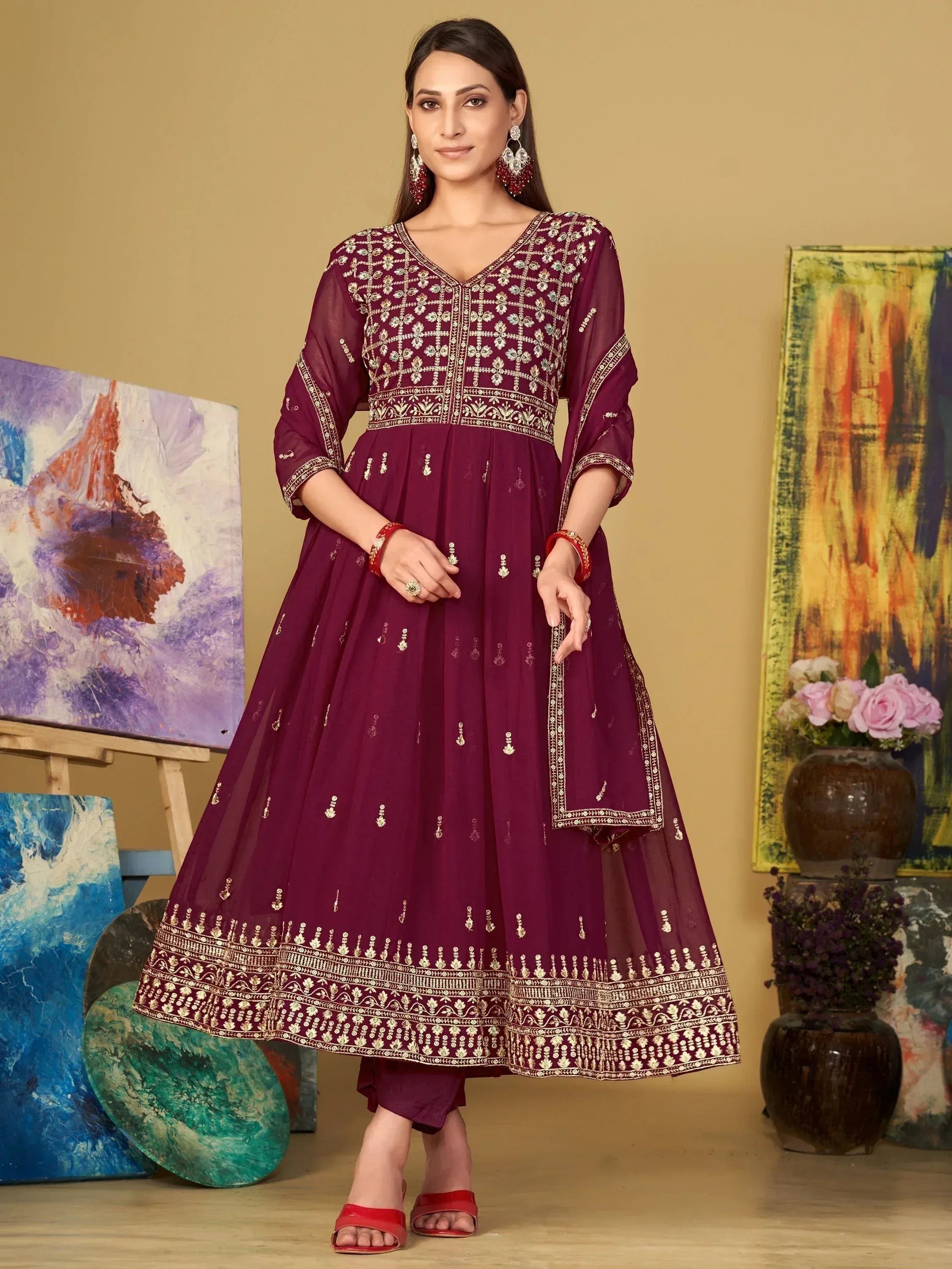 Maroon embroidered anarkali suit with gold detailing, perfect for Indian ethnic wear and festive occasions.