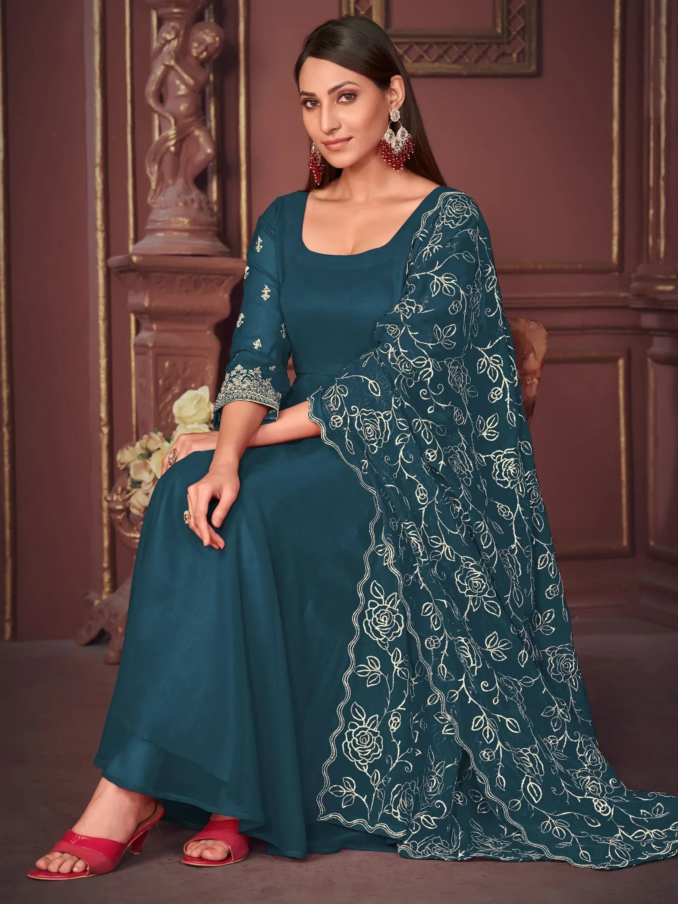 Teal ethnic gown with gold floral embroidery, perfect for Indian occasions and festive wear.
