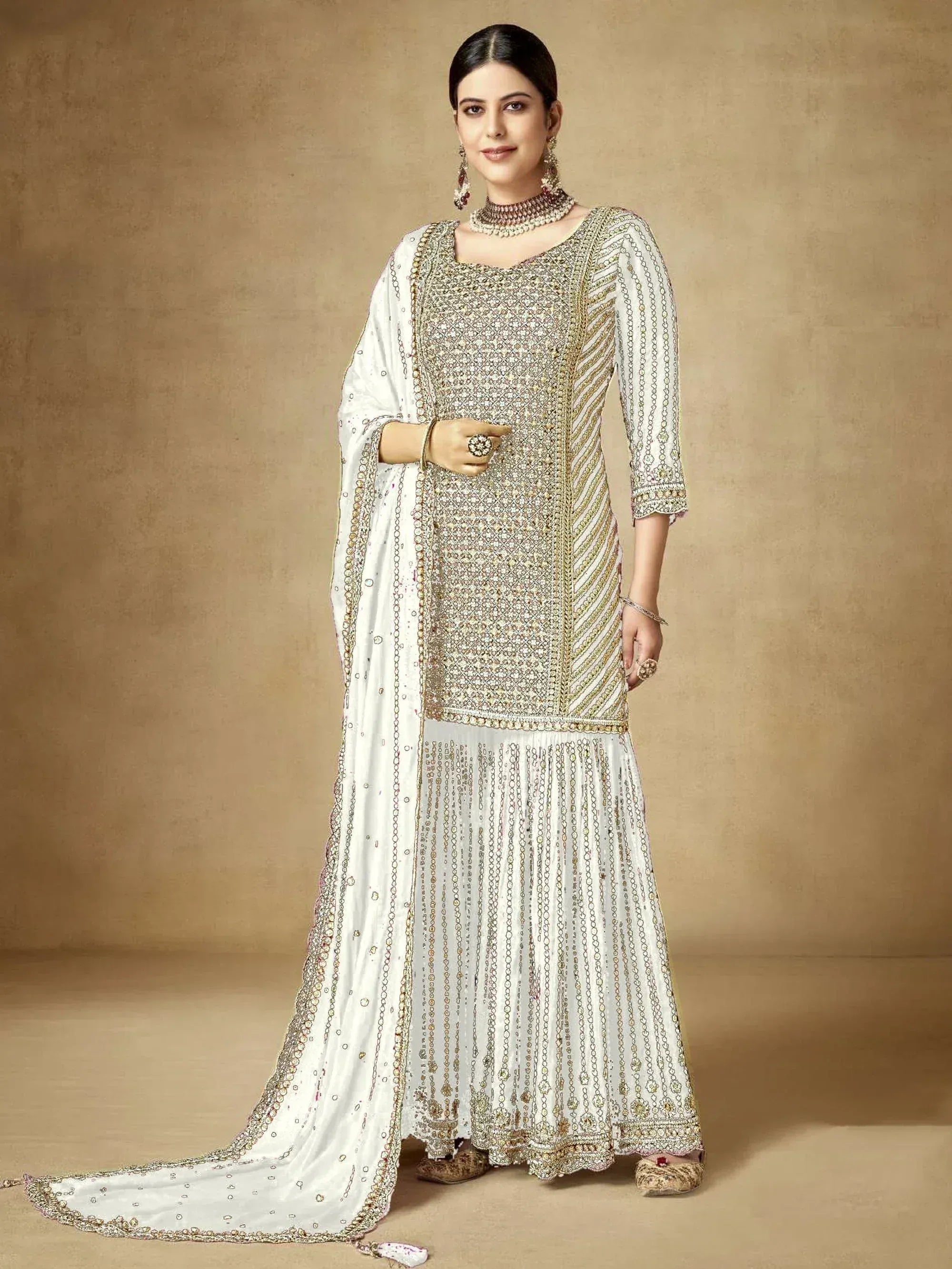 Elegant white and gold embroidered salwar kameez with dupatta, perfect for Indian ethnic occasions
