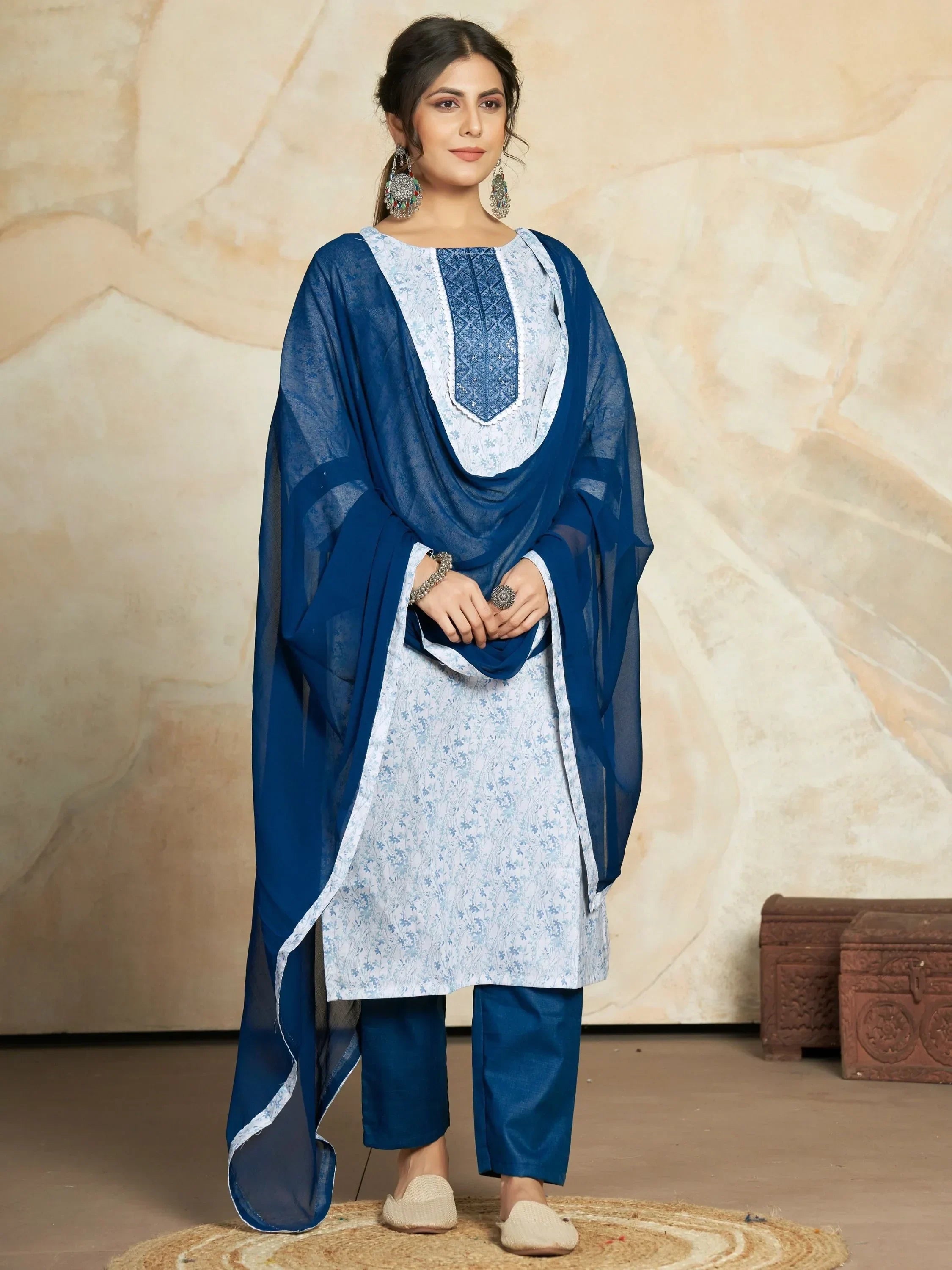 Woman wearing blue and white salwar kameez with printed kurta and matching dupatta