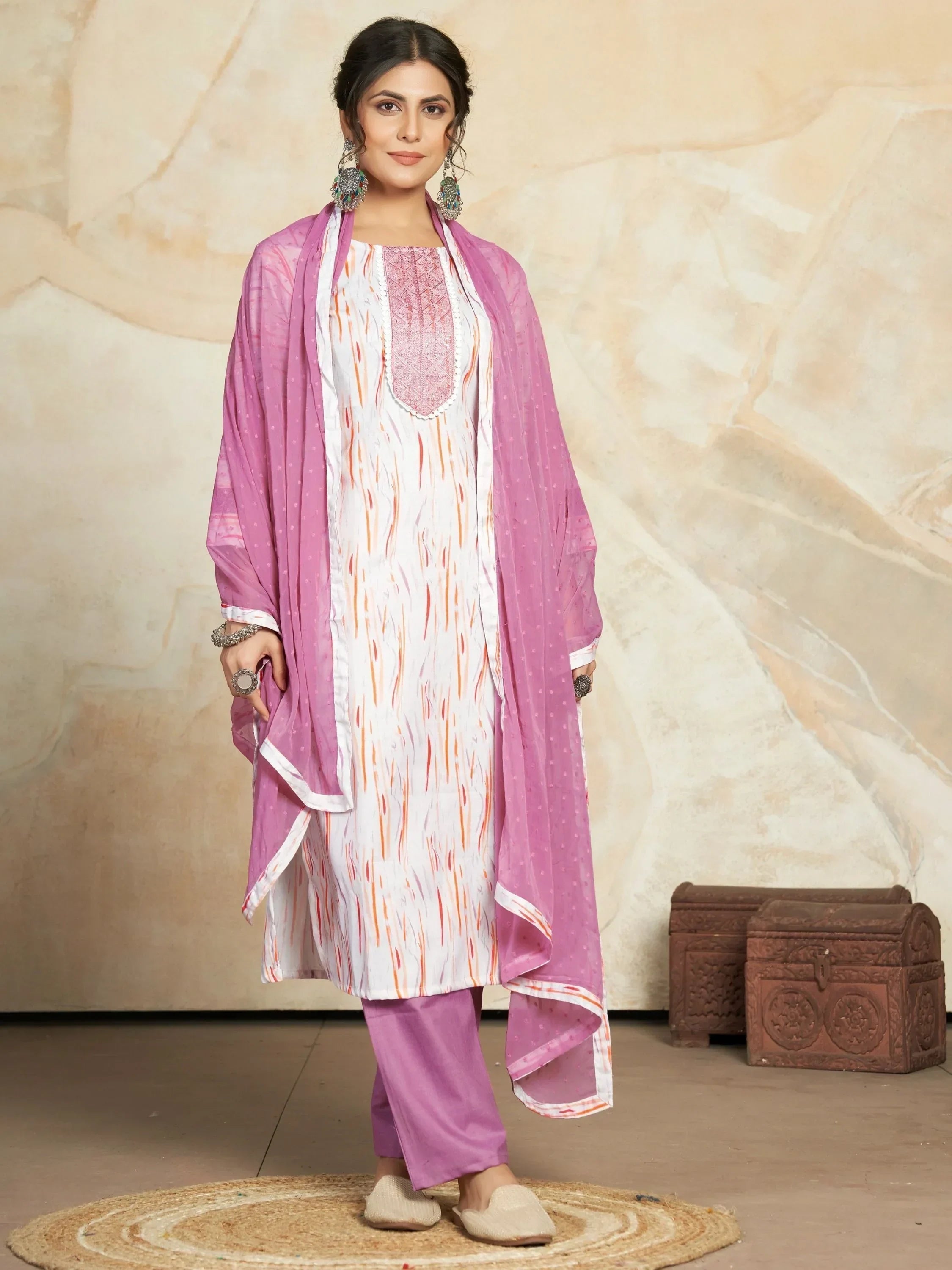 Woman in white and lavender salwar kameez set with dupatta, ethnic Indian wear