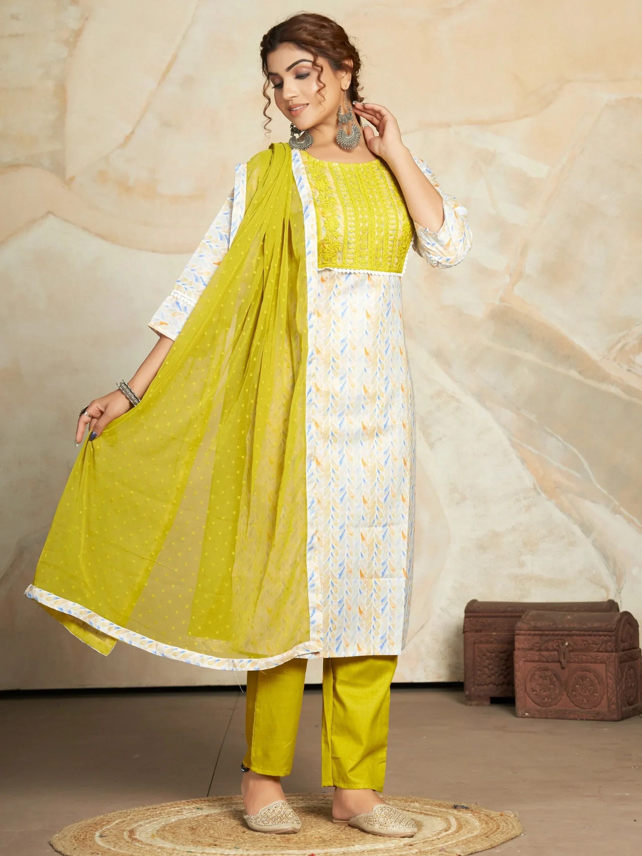 Woman wearing printed salwar kameez with lime green dupatta and pants, ethnic fashion style
