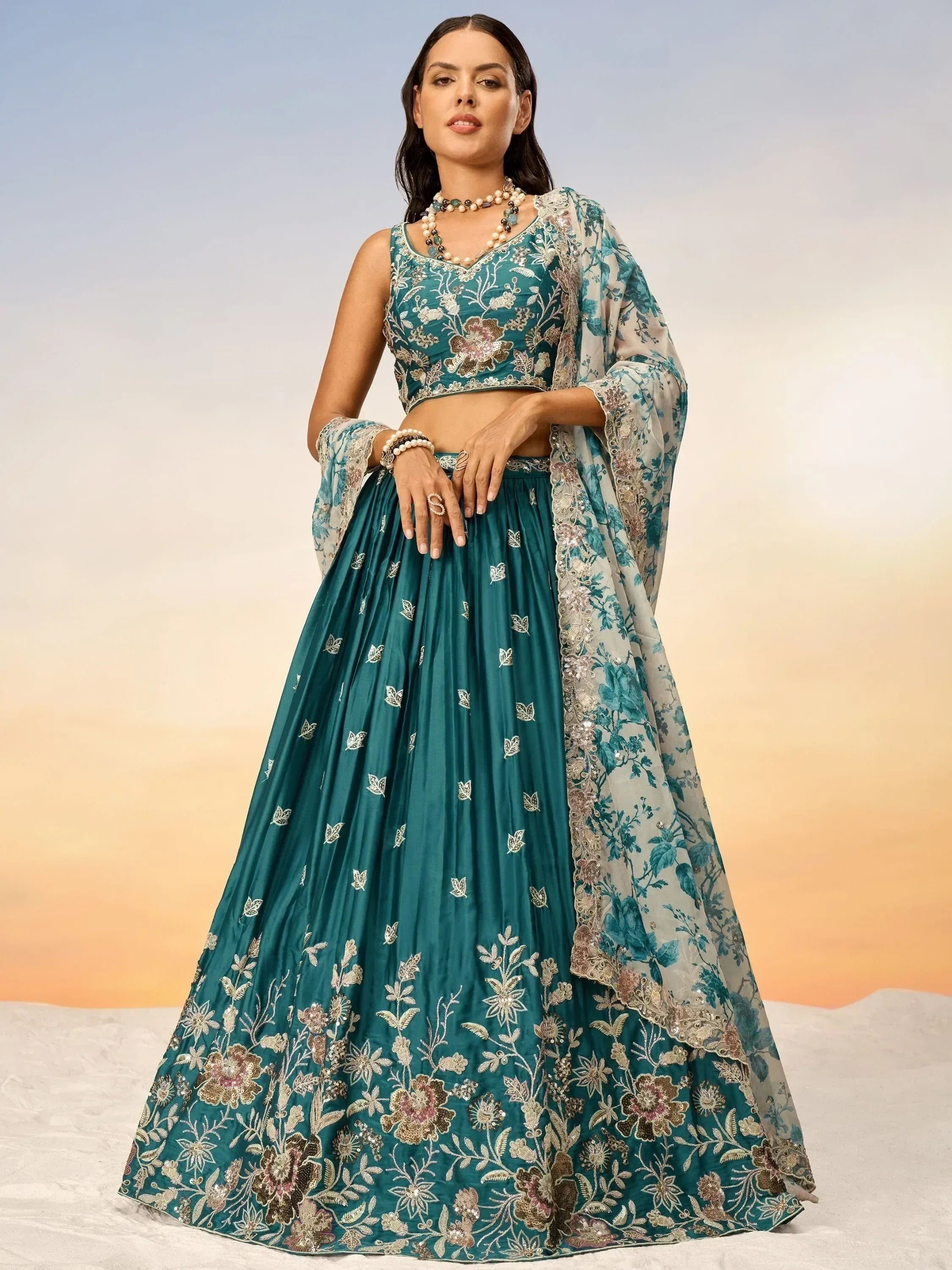 Teal embroidered lehenga choli with floral dupatta, perfect for Indian ethnic wear occasions.