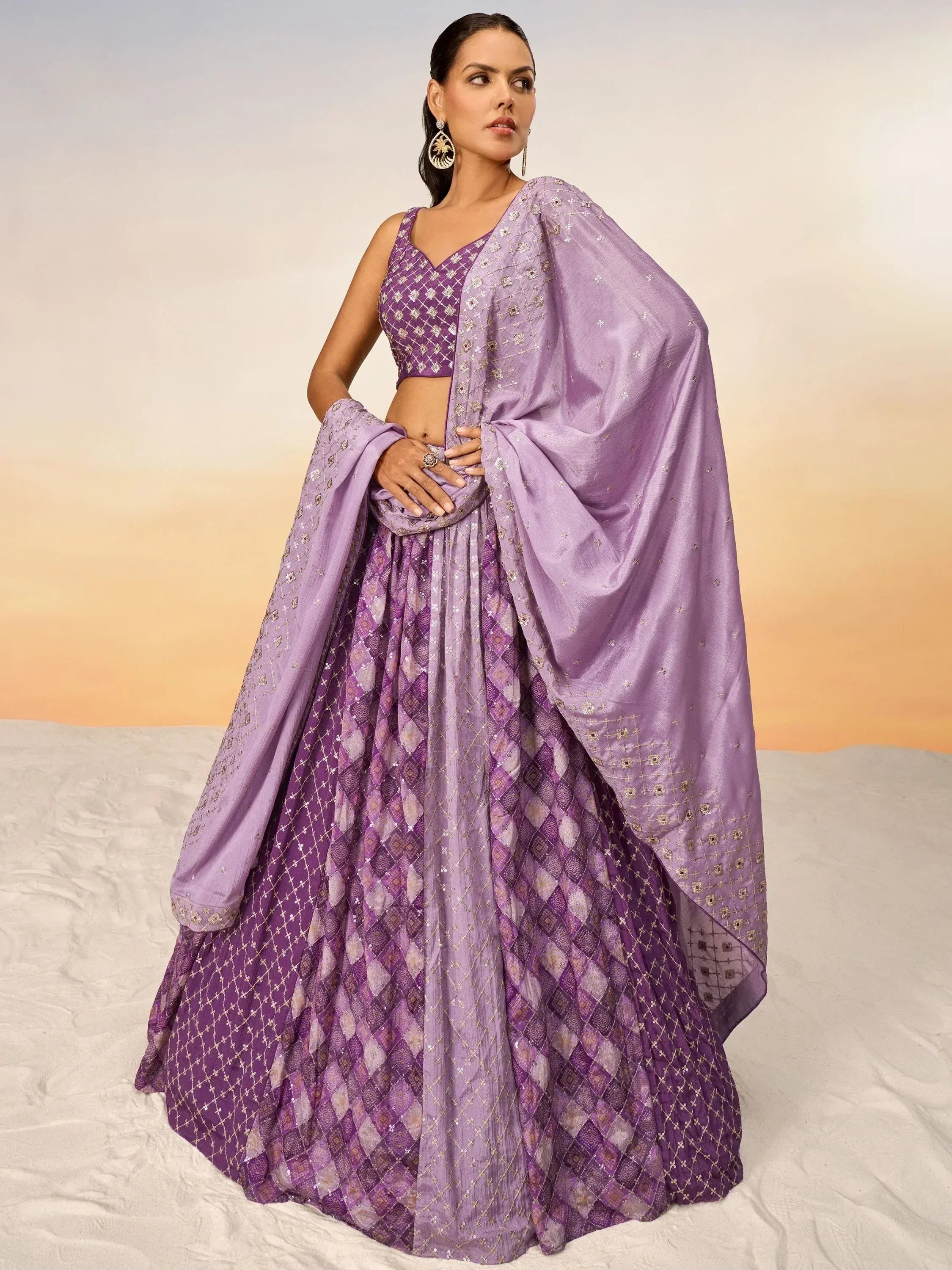 Purple designer lehenga choli with intricate embroidery and matching dupatta for ethnic wear