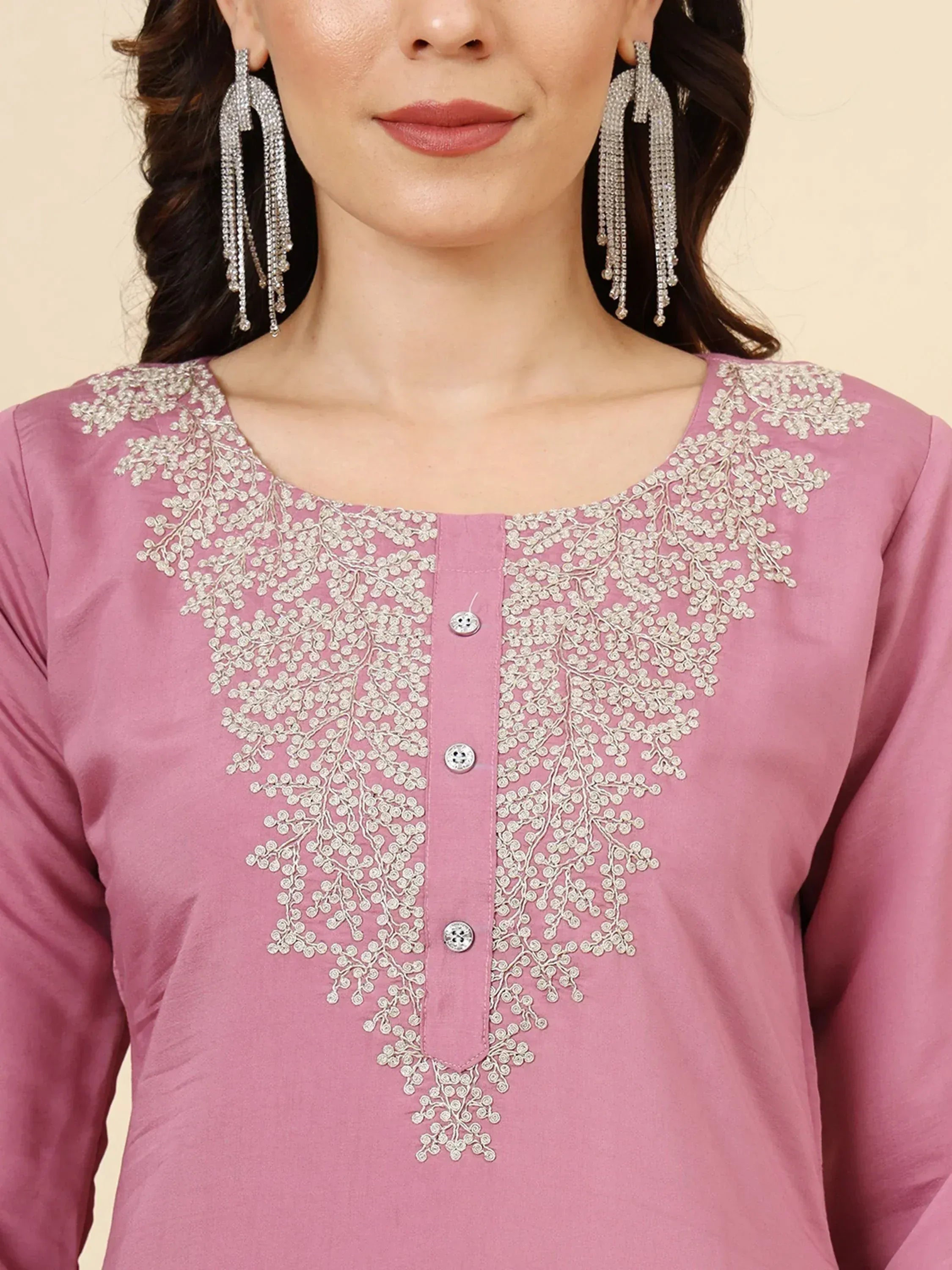 Pink ethnic kurti with silver floral embroidery and matching statement earrings