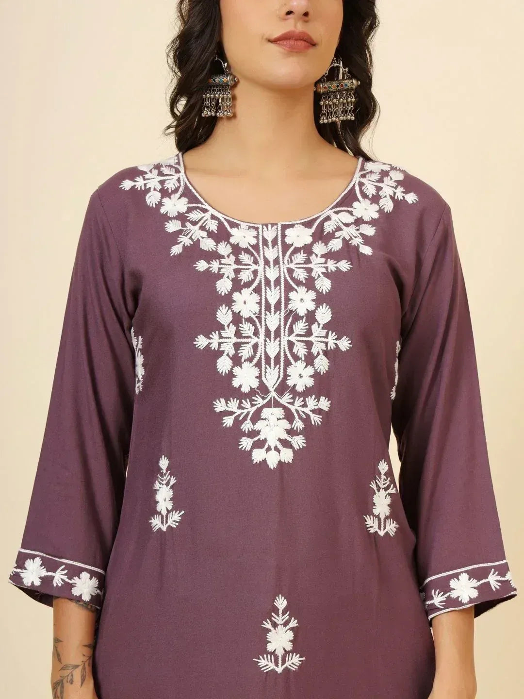 Purple ethnic kurti with white floral embroidery, perfect for Indian wear and festive occasions.