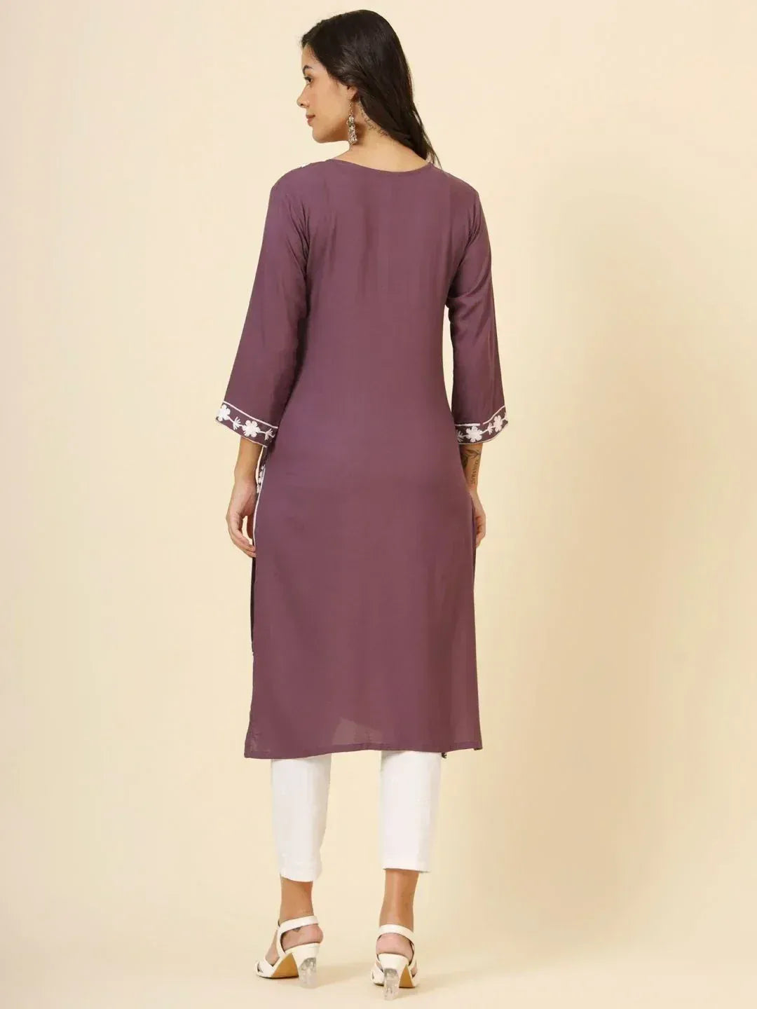 Purple ethnic kurta with white floral embroidery on sleeves, paired with white pants for women