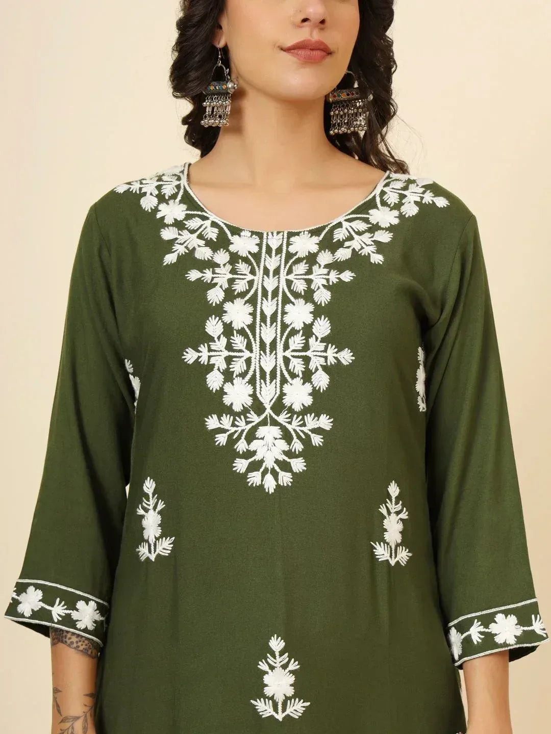 Olive green kurti with white floral embroidery and three-quarter sleeves