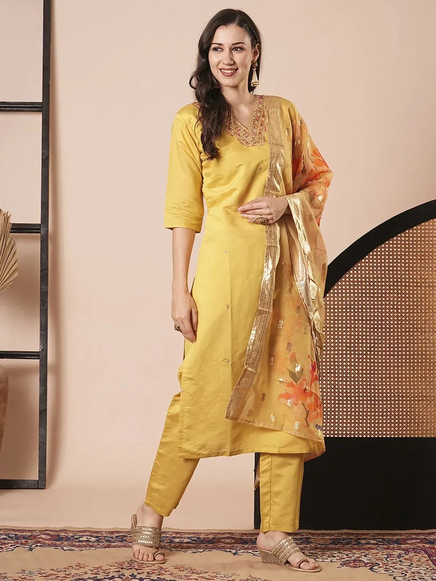 Yellow ethnic salwar kameez with floral dupatta, perfect for Indian occasions and festive wear.