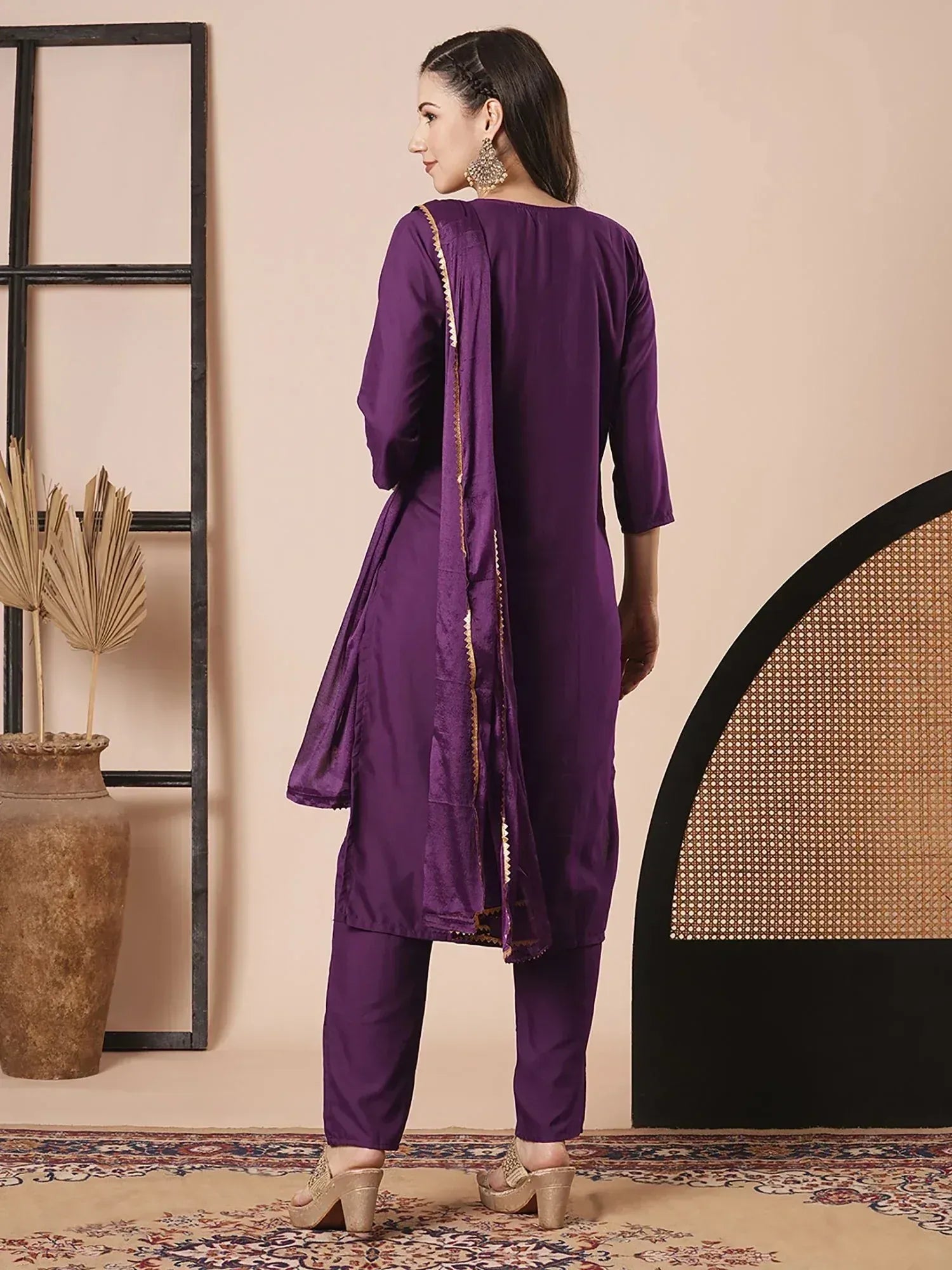 Purple ethnic salwar kameez with gold trim, perfect for Indian occasions and festive wear