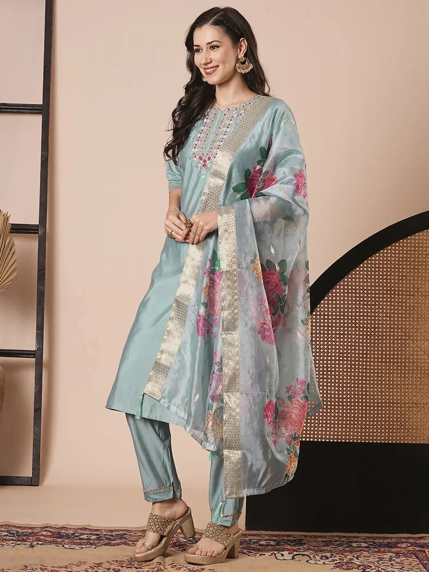 Light blue embroidered salwar kameez with floral dupatta, perfect for Indian ethnic wear occasions.