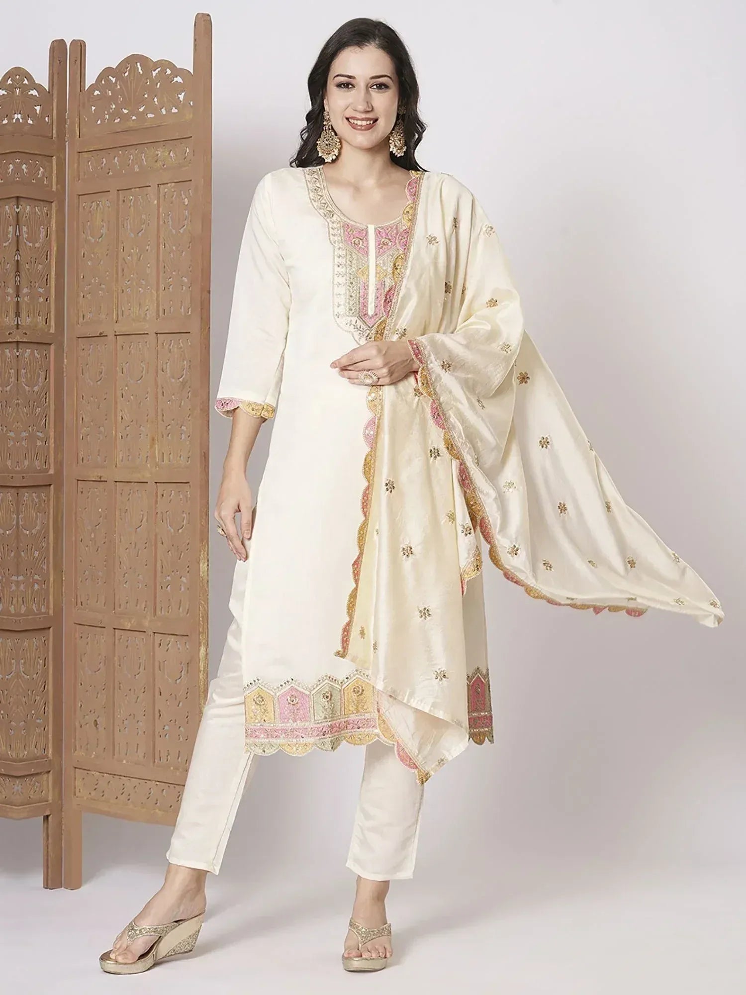 Cream embroidered salwar kameez with pink gold detailing, perfect for Indian ethnic wear occasions