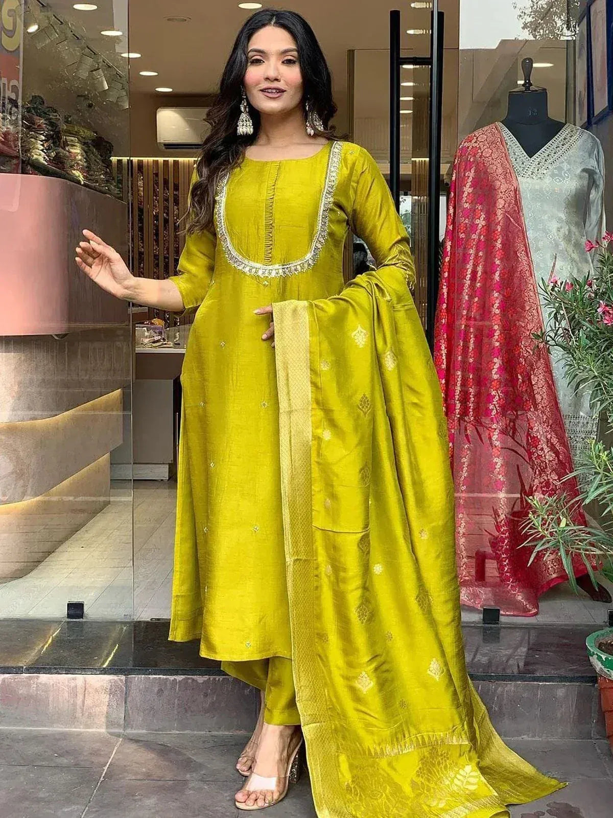 Vibrant yellow ethnic salwar kameez with gold embroidery, perfect for Indian festive wear