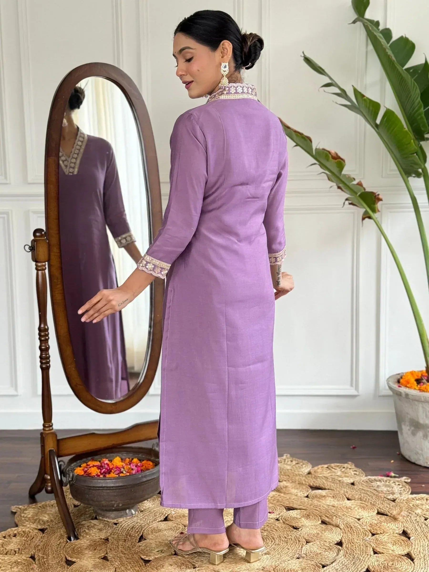 Purple ethnic kurta with embroidered neckline and sleeves, paired with matching pants, ideal for Indian wear