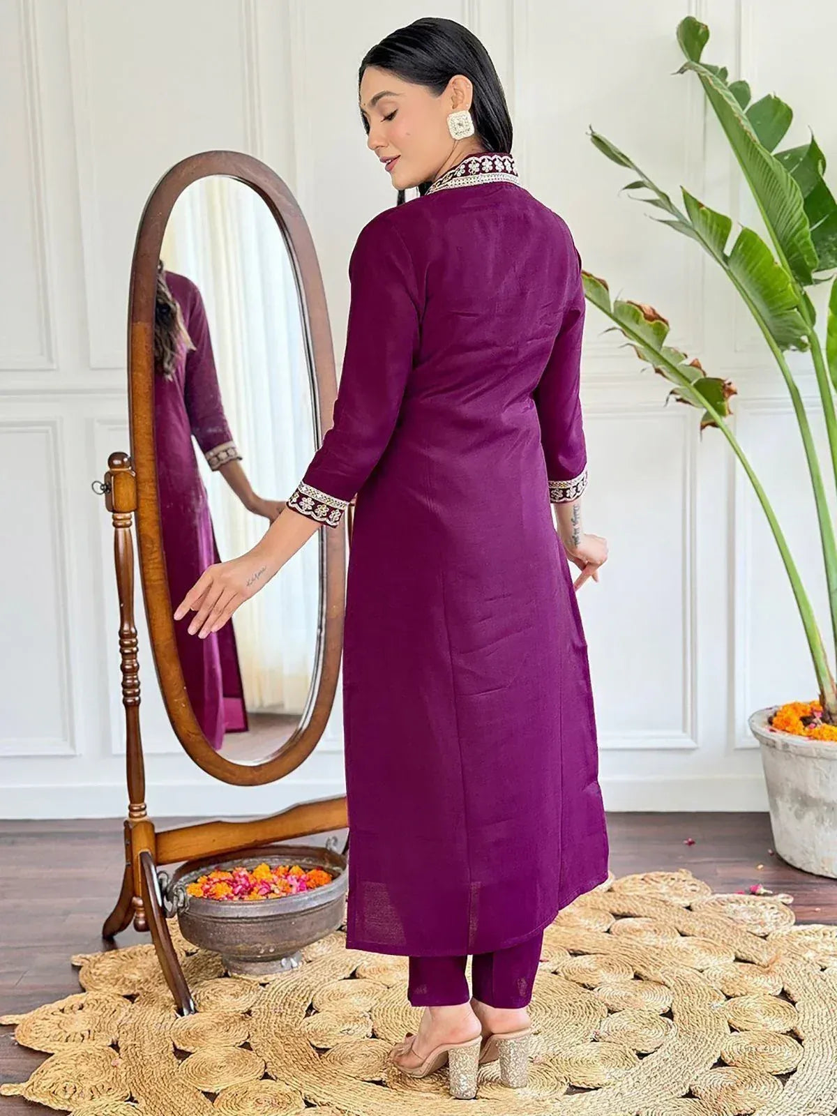 Purple ethnic kurta with embroidered collar and cuffs, paired with matching pants, styled for Indian wear