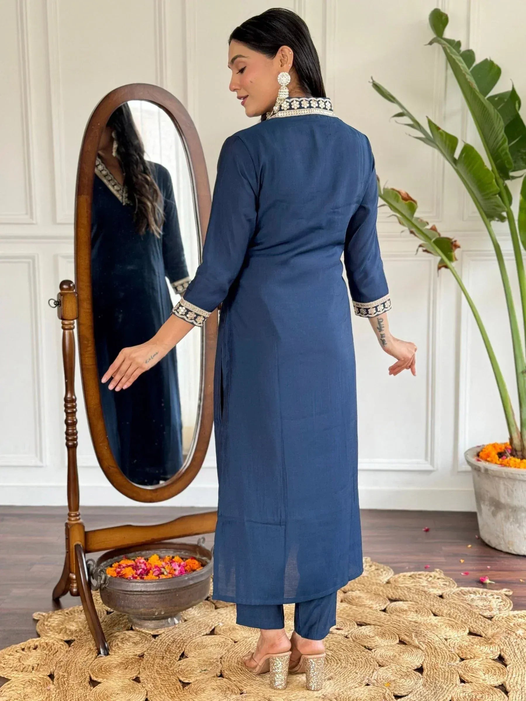 Navy blue ethnic kurta with floral embroidery, paired with matching pants, ideal for Indian festive occasions.