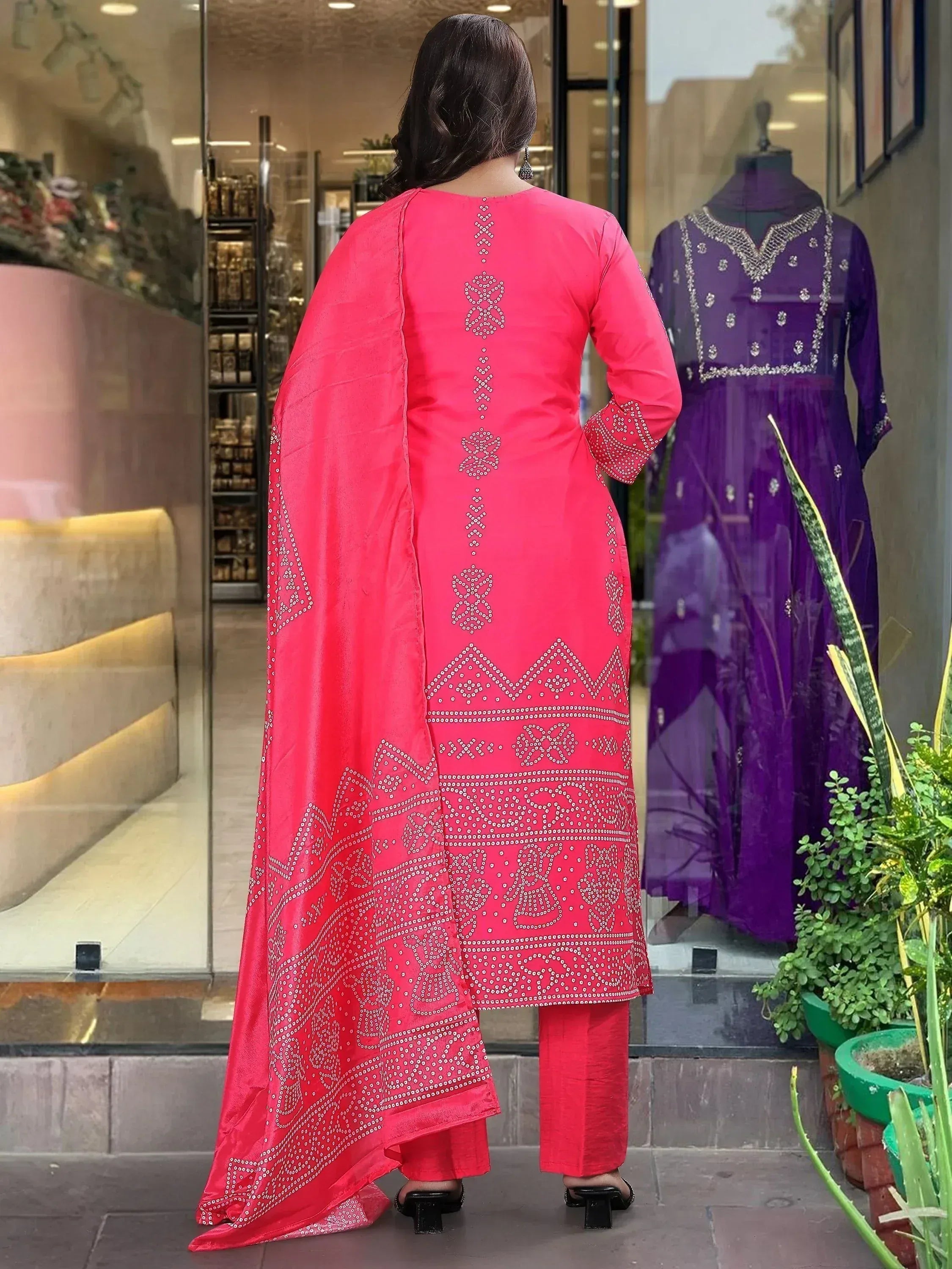 Pink embroidered salwar kameez with mirror work, back view, paired with matching pants and dupatta