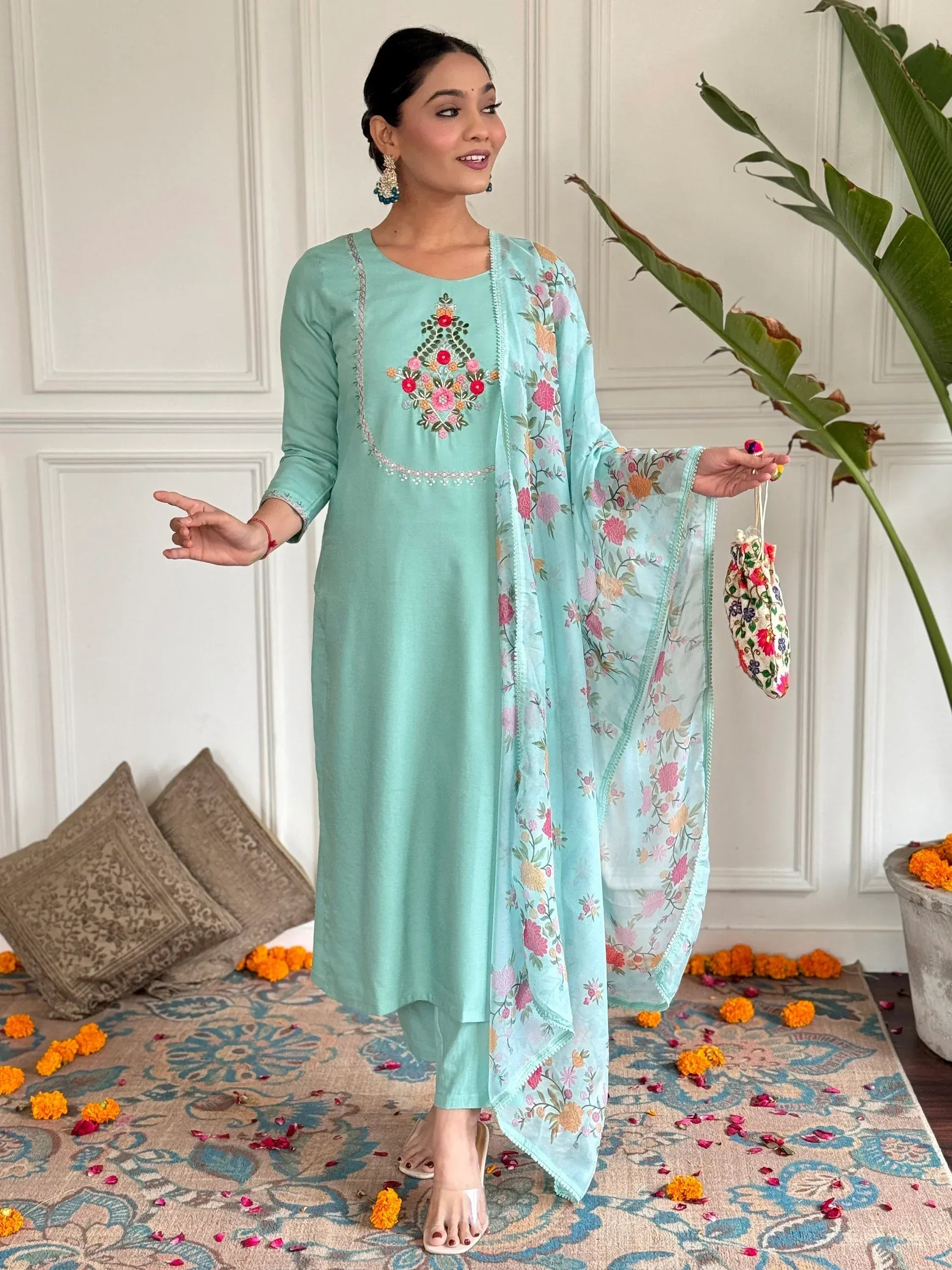 Mint green embroidered salwar kameez with floral dupatta, perfect for Indian ethnic wear occasions.