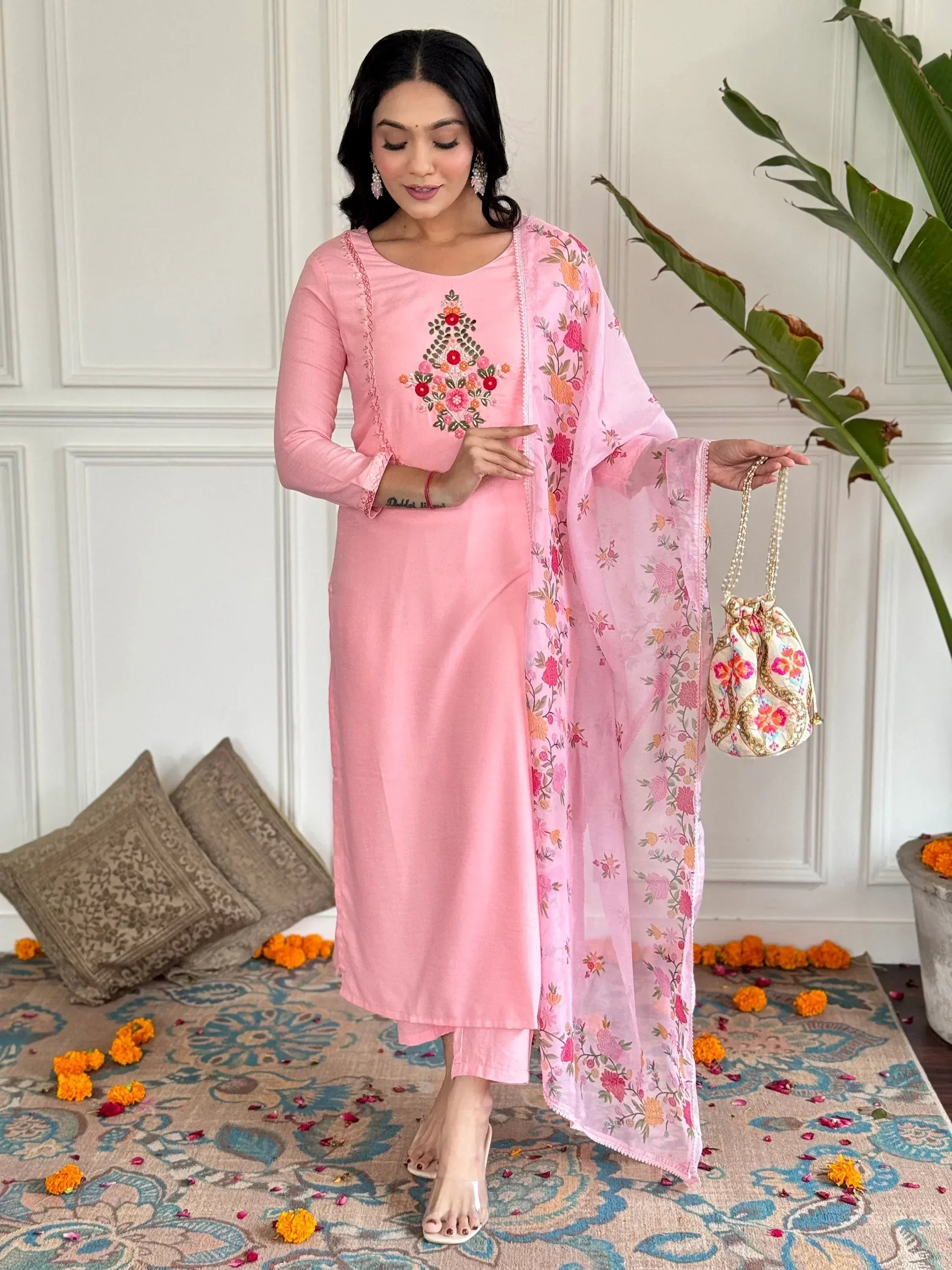 Pink embroidered salwar kameez with floral dupatta and potli bag, Indian ethnic wear