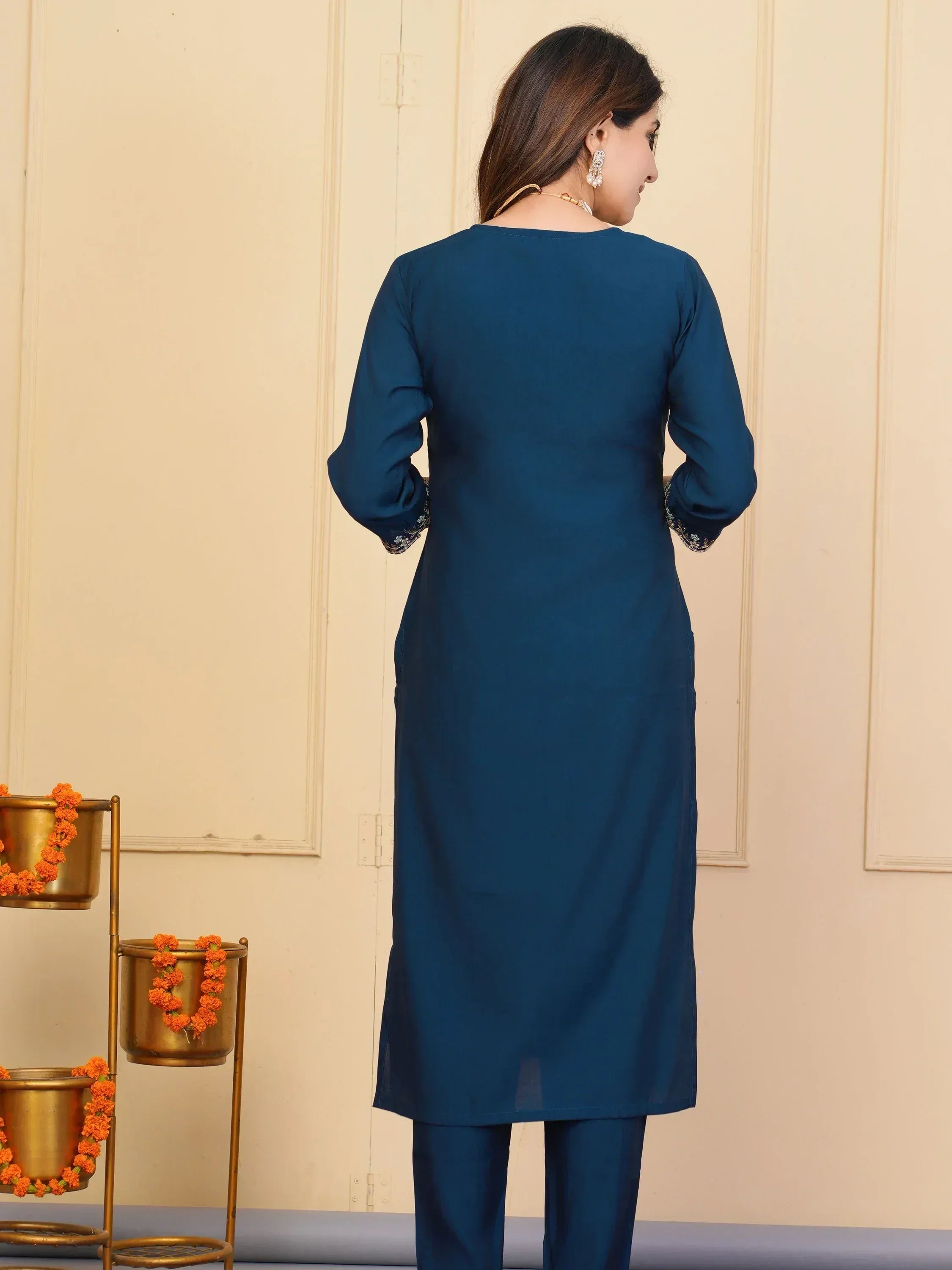 Blue ethnic kurti with embroidered sleeves paired with matching pants, ideal for Indian wear occasions