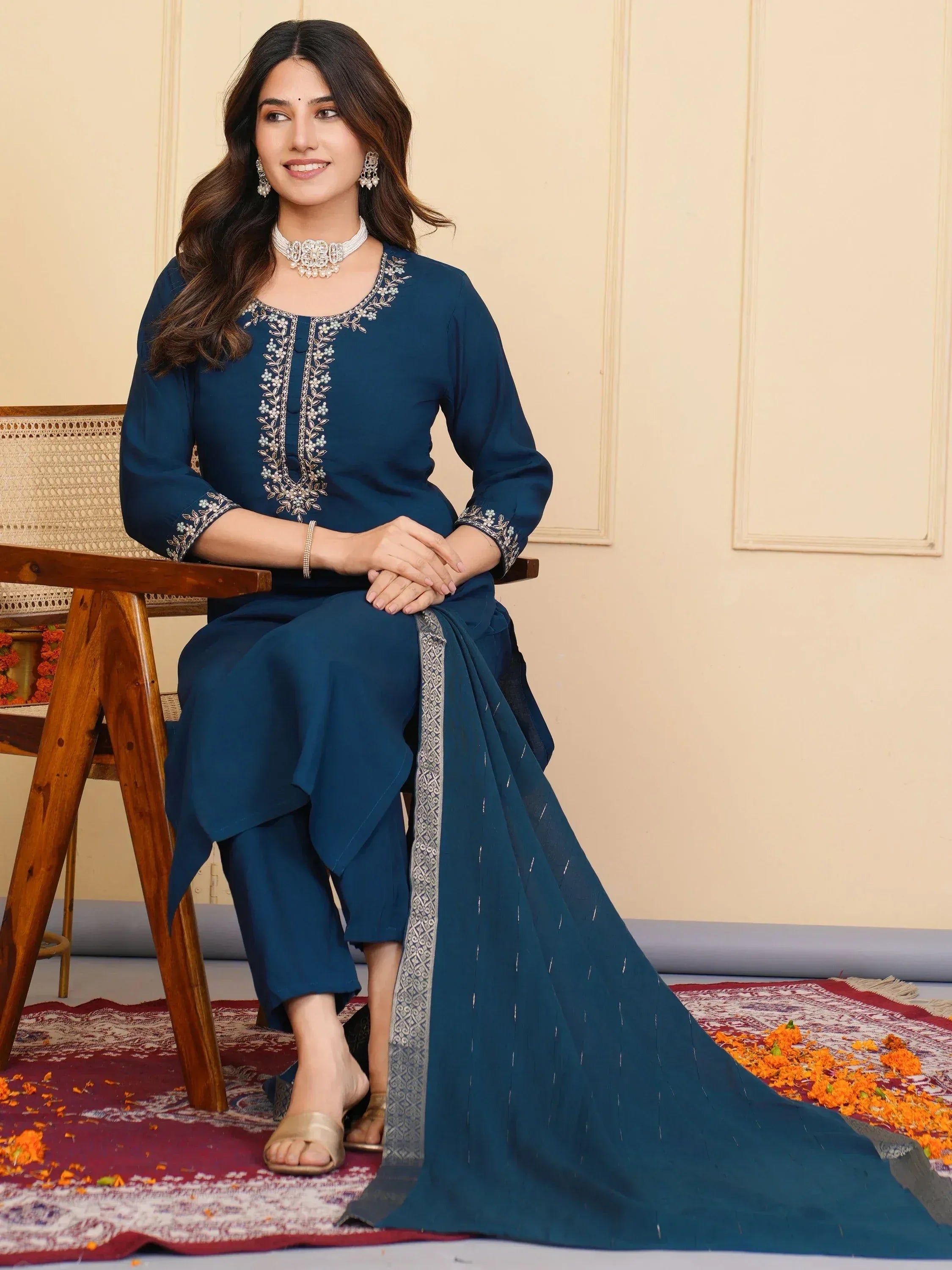 Woman in navy blue embroidered salwar kameez with dupatta, ethnic Indian wear for festive occasions