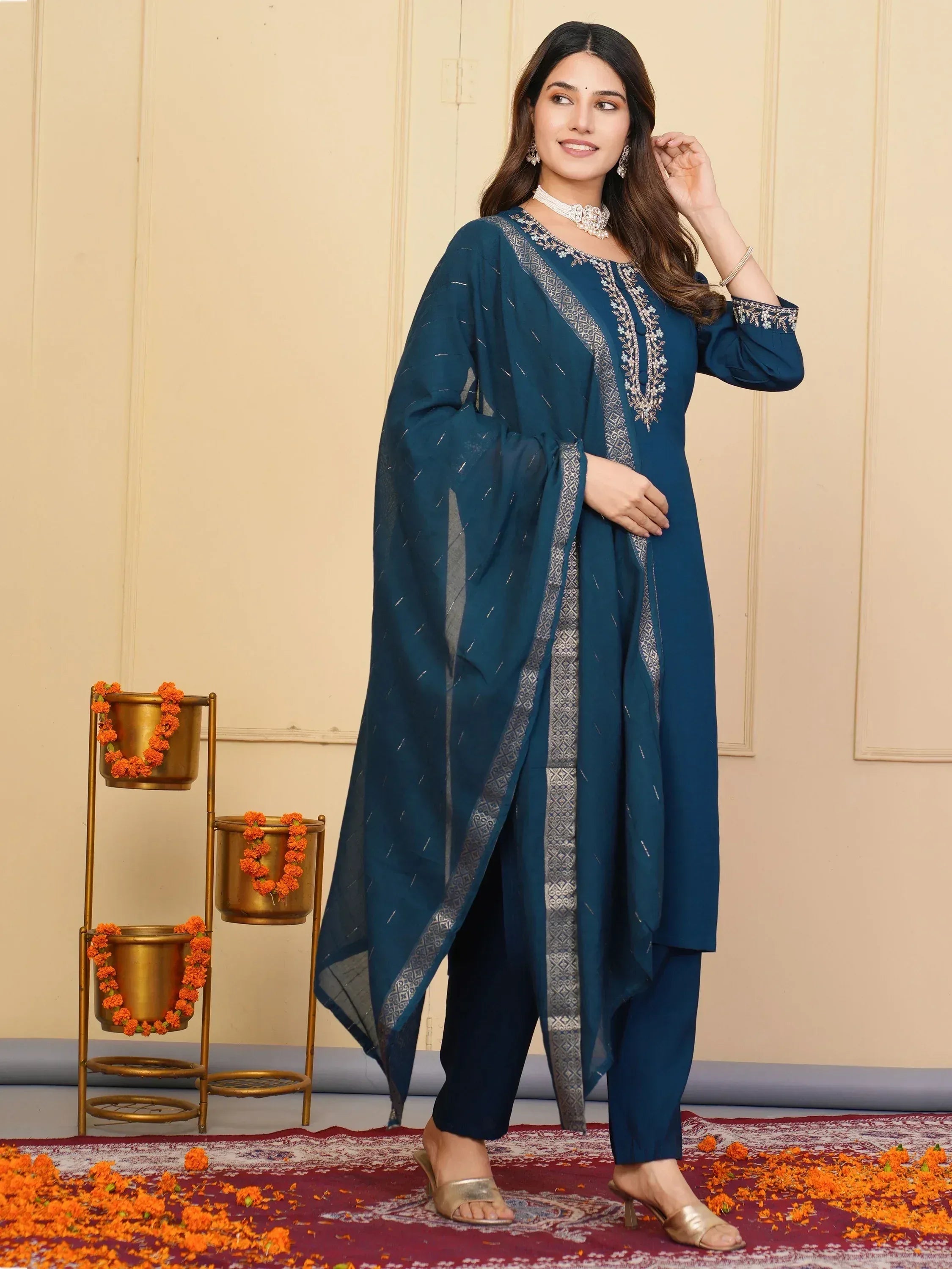 Teal embroidered salwar kameez with silver detailing, perfect for Indian ethnic wear occasions