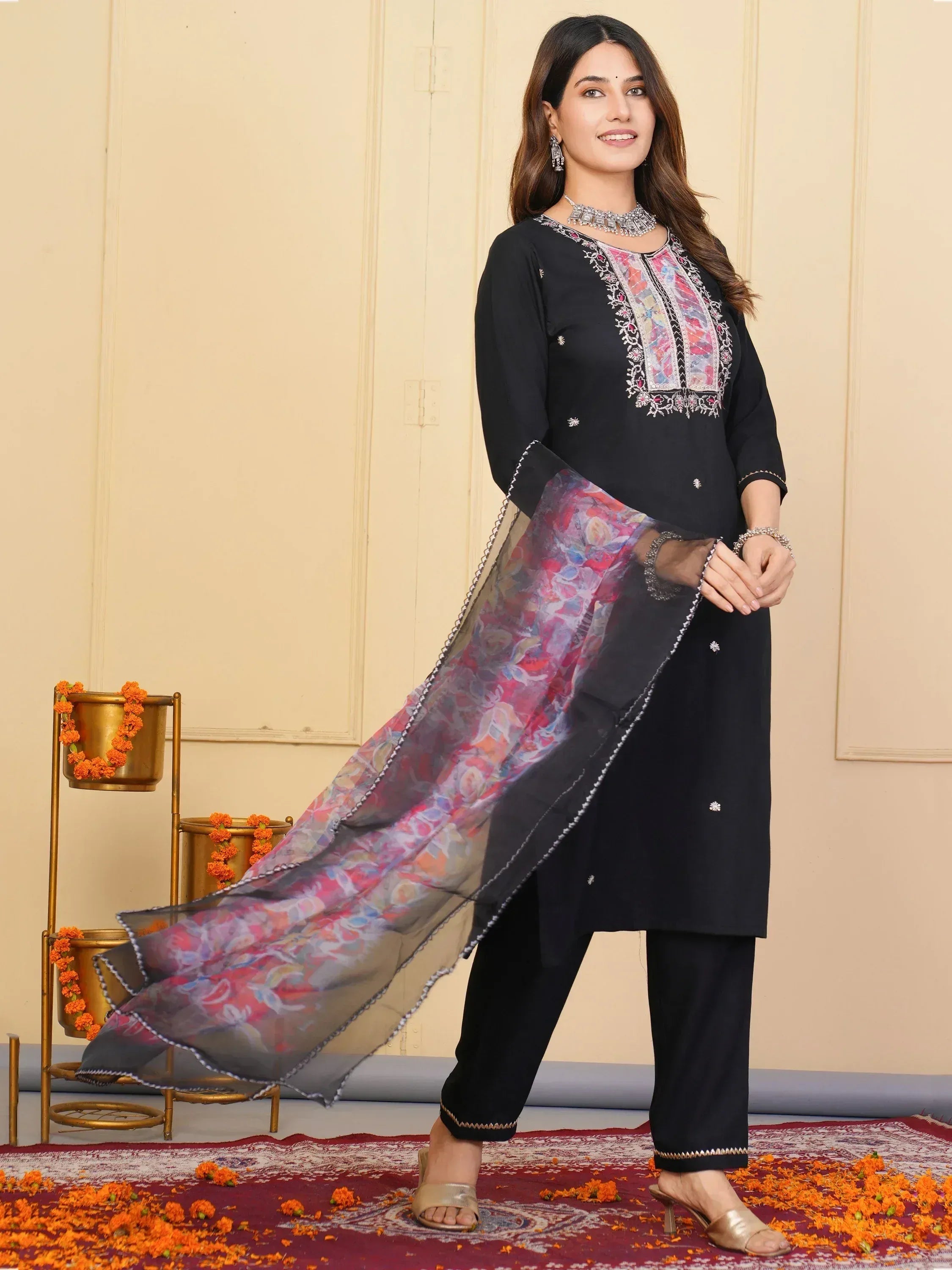 Black embroidered salwar kameez with floral dupatta, perfect for Indian ethnic wear occasions