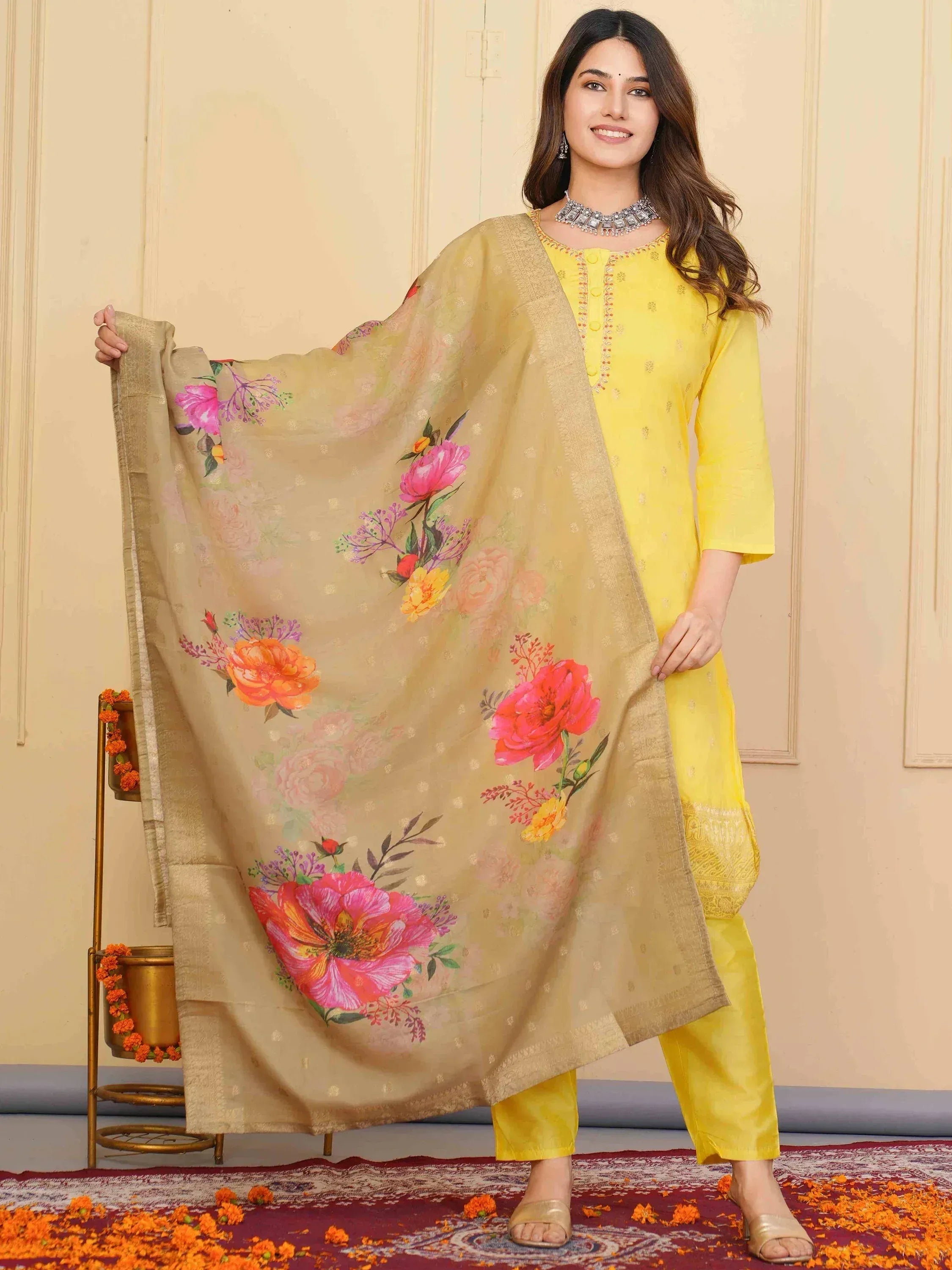 Yellow ethnic salwar kameez with floral dupatta, perfect for festive occasions