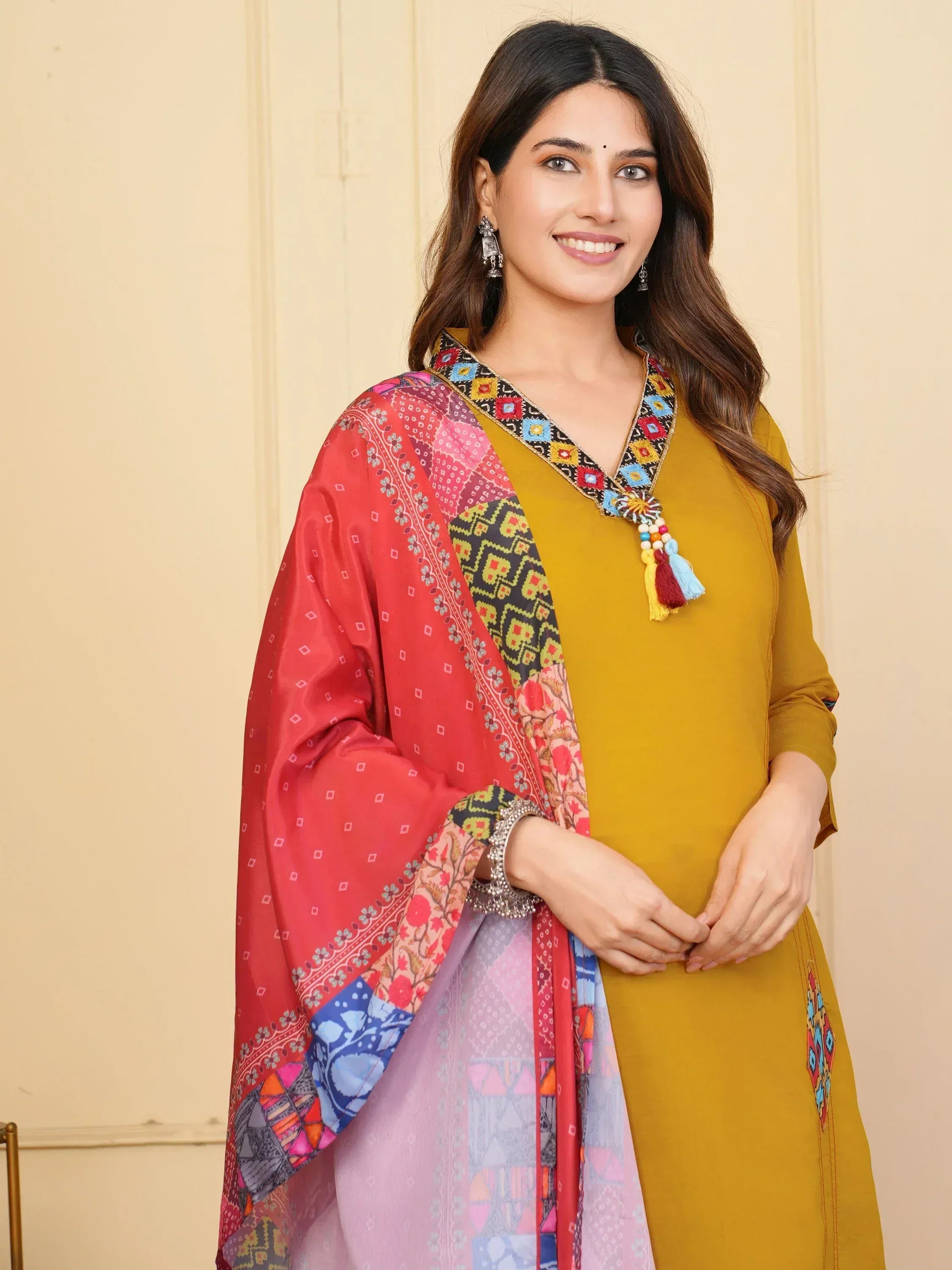 Woman in mustard yellow ethnic kurta with colorful printed dupatta, perfect for Indian festive occasions