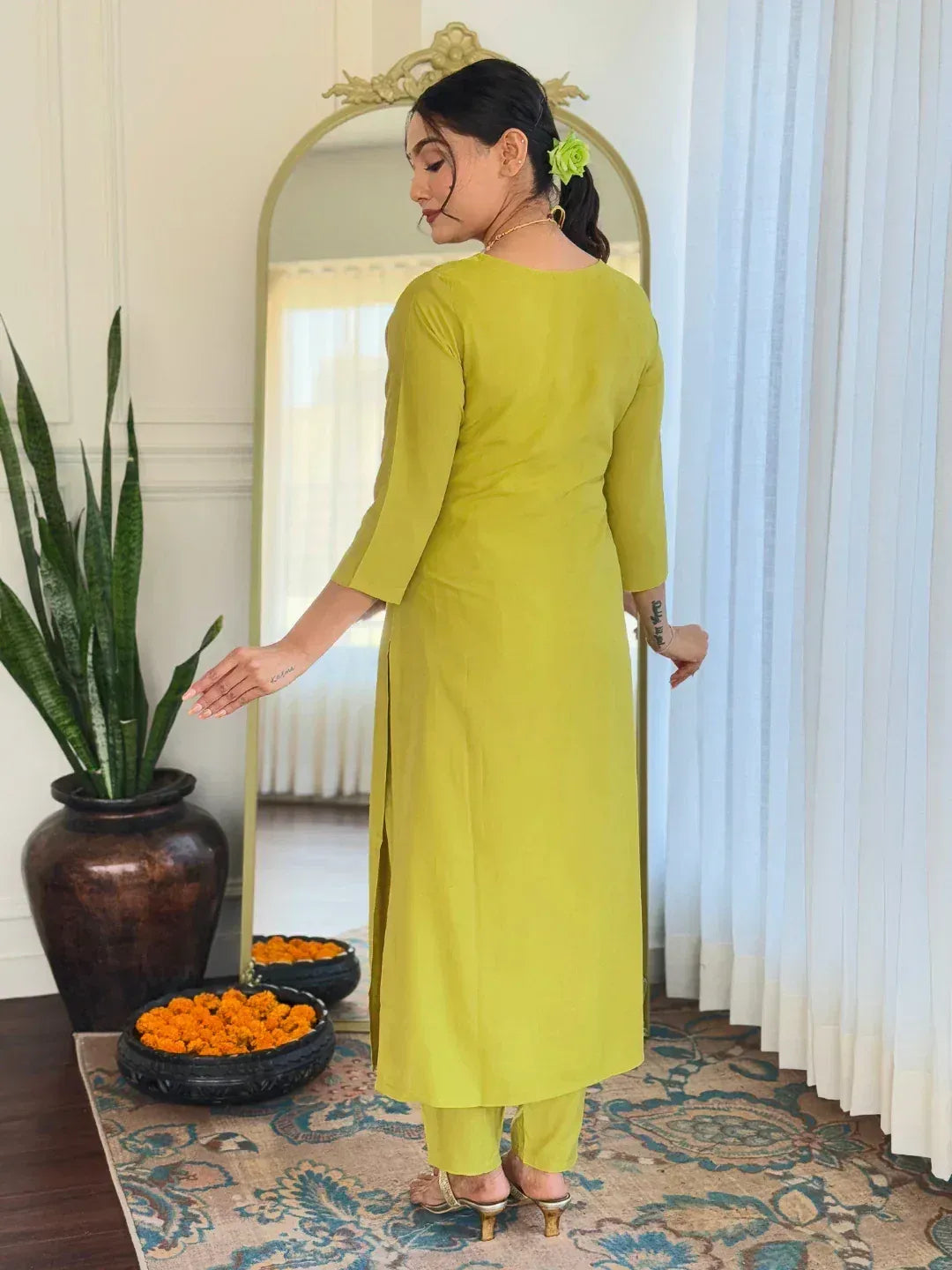 Lime green ethnic kurta with side slit, paired with matching pants, styled for Indian wear