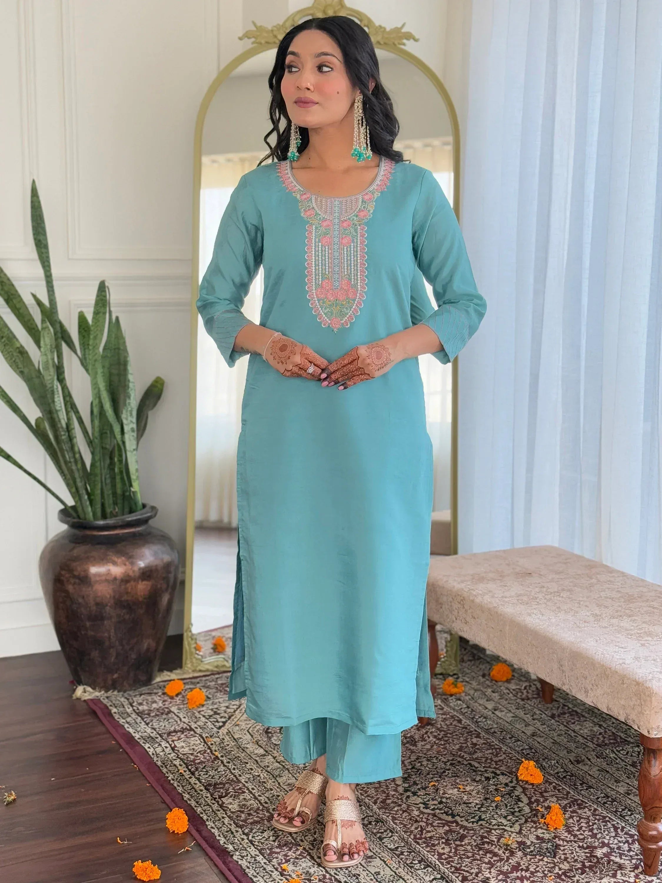Turquoise embroidered kurta with matching palazzo, henna hands, and ethnic jewelry for Indian wear.