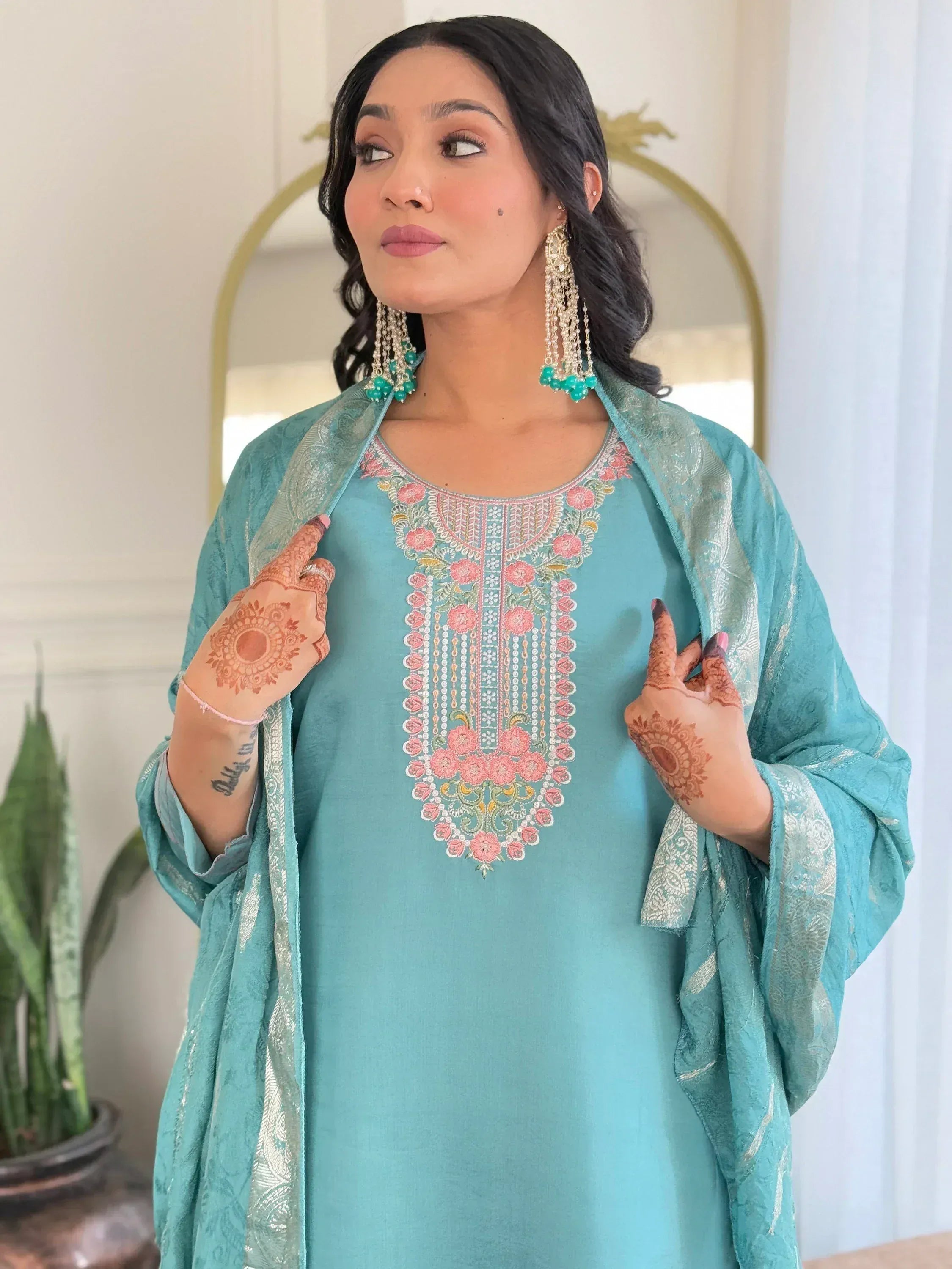 Turquoise embroidered kurta with floral neckline, matching dupatta, and statement earrings for Indian ethnic wear