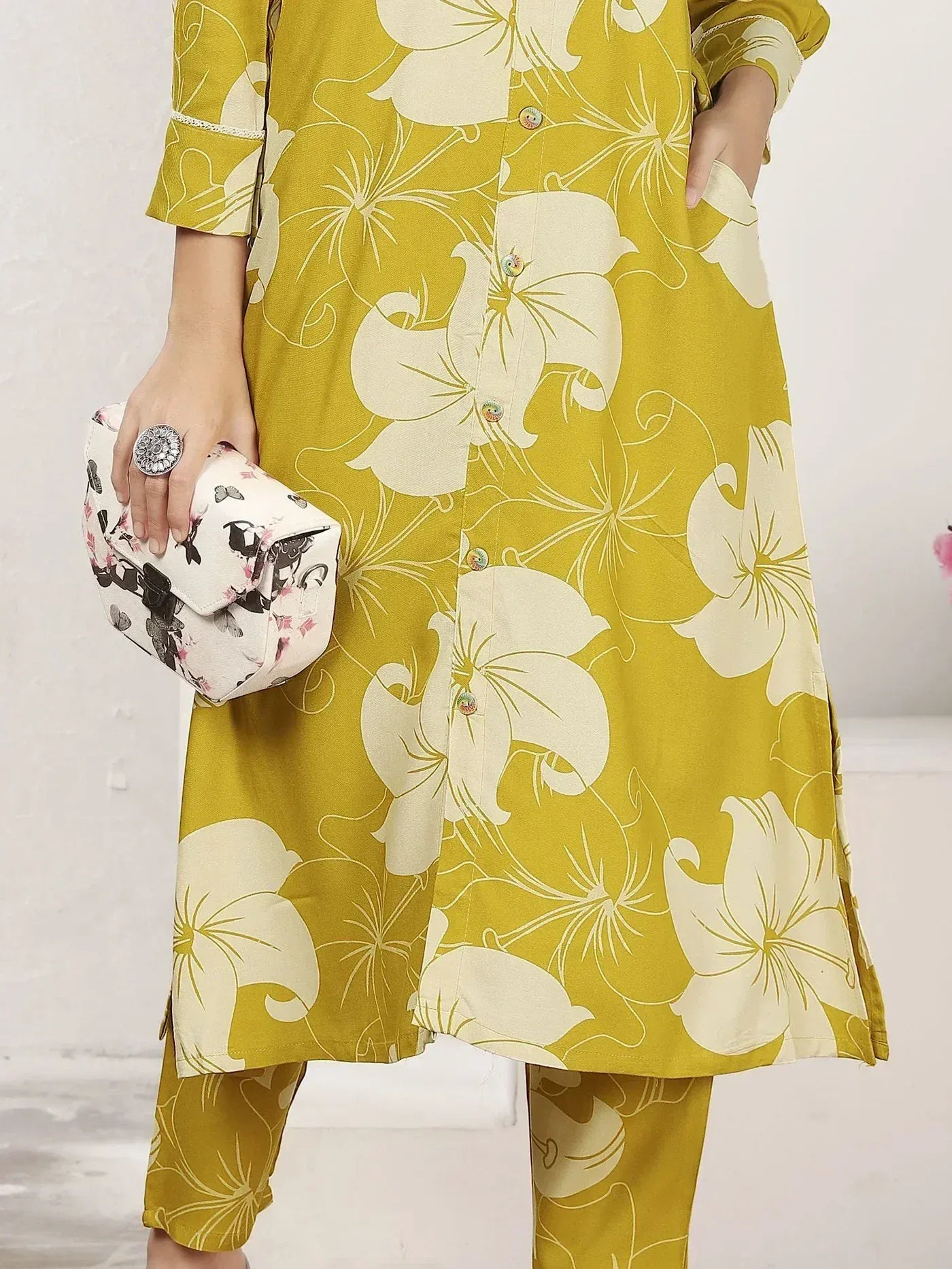 Yellow floral printed ethnic kurta with matching pants and clutch