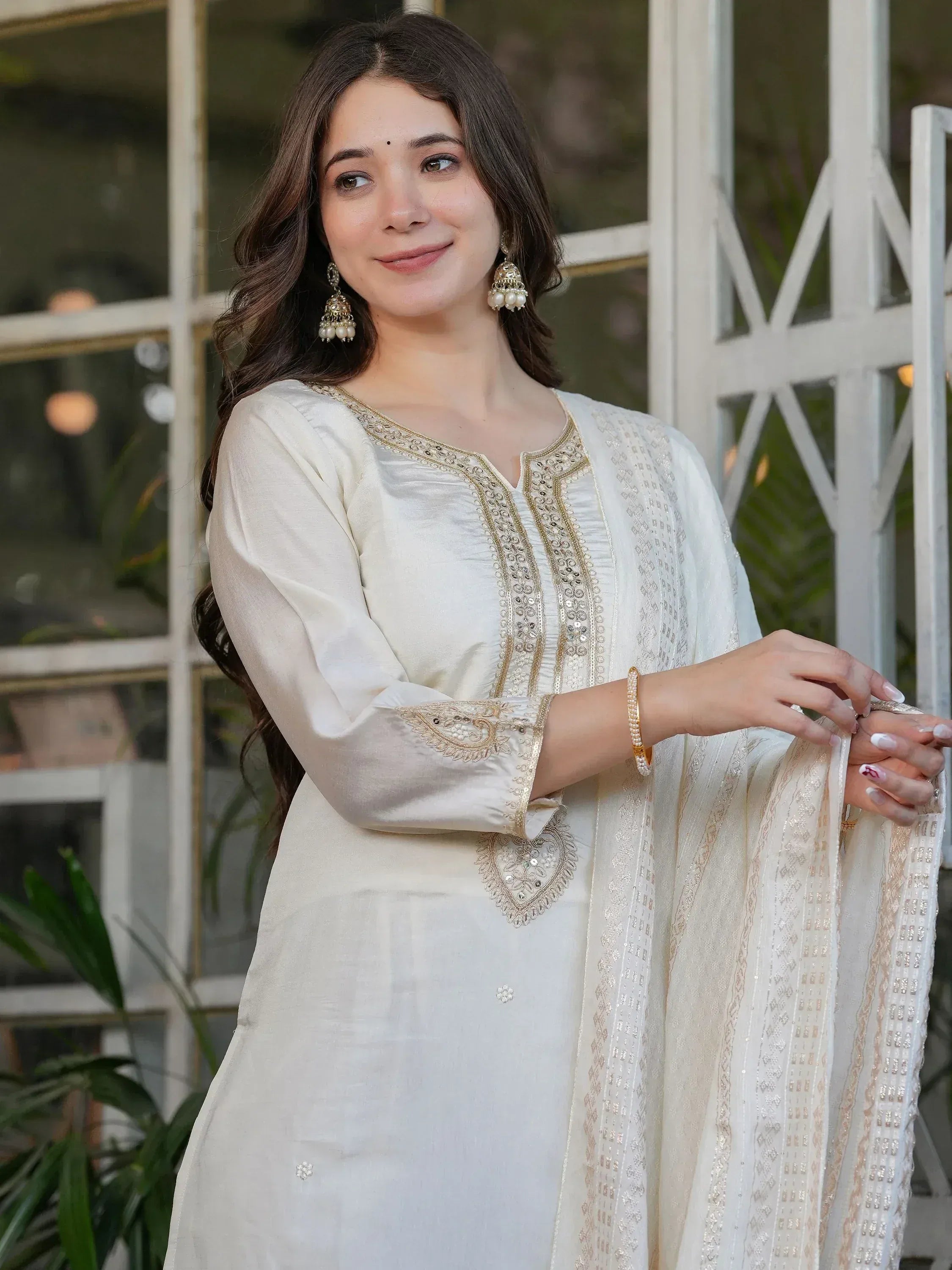 Elegant white ethnic kurti with gold embroidery and matching dupatta, perfect for Indian festive wear.