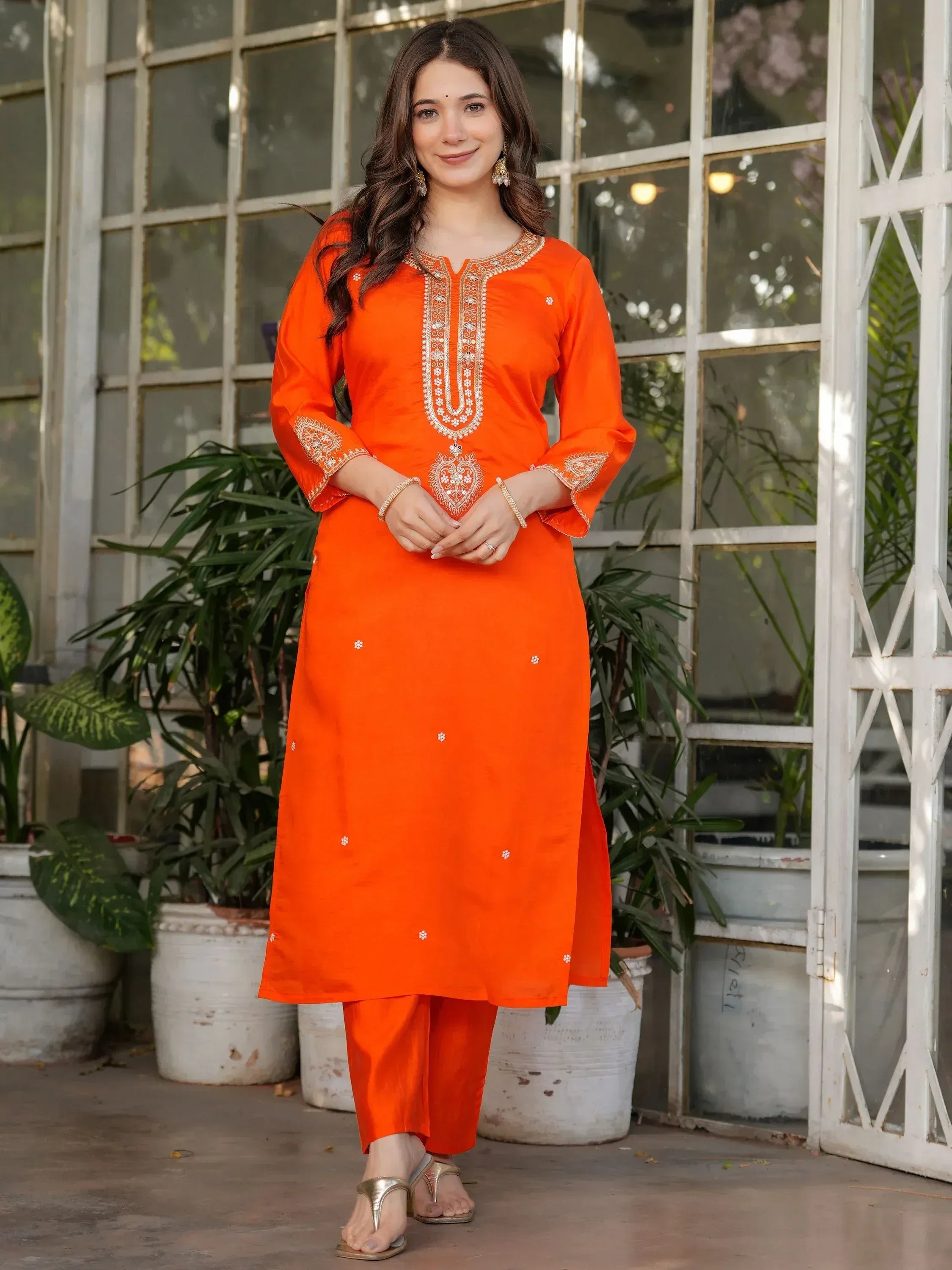 Vibrant orange embroidered kurta with matching pants, perfect for Indian ethnic wear occasions.