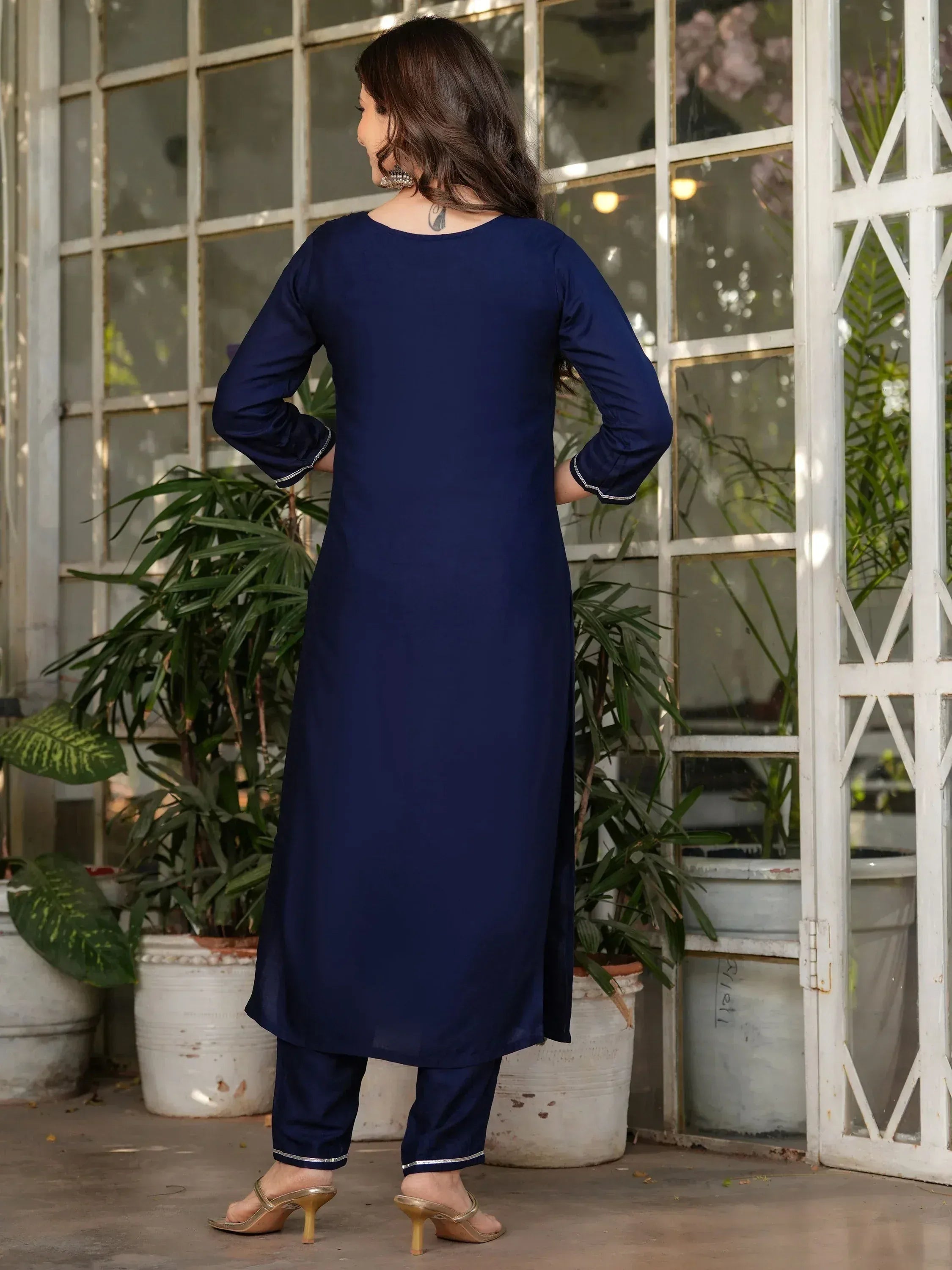 Navy blue ethnic kurta set with silver trim, styled for women's traditional wear