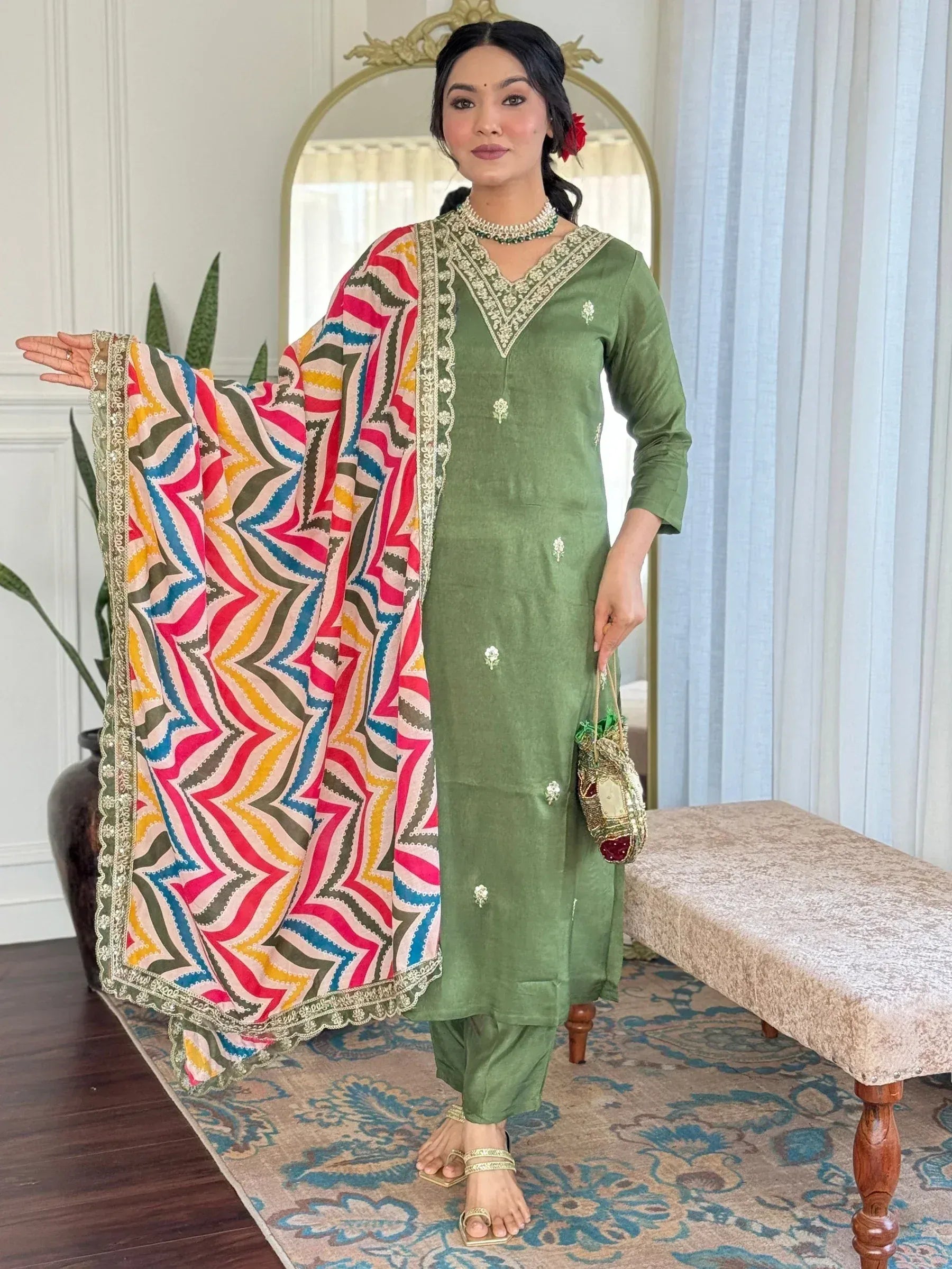 Green embroidered salwar kameez with colorful printed dupatta, perfect for Indian ethnic wear occasions