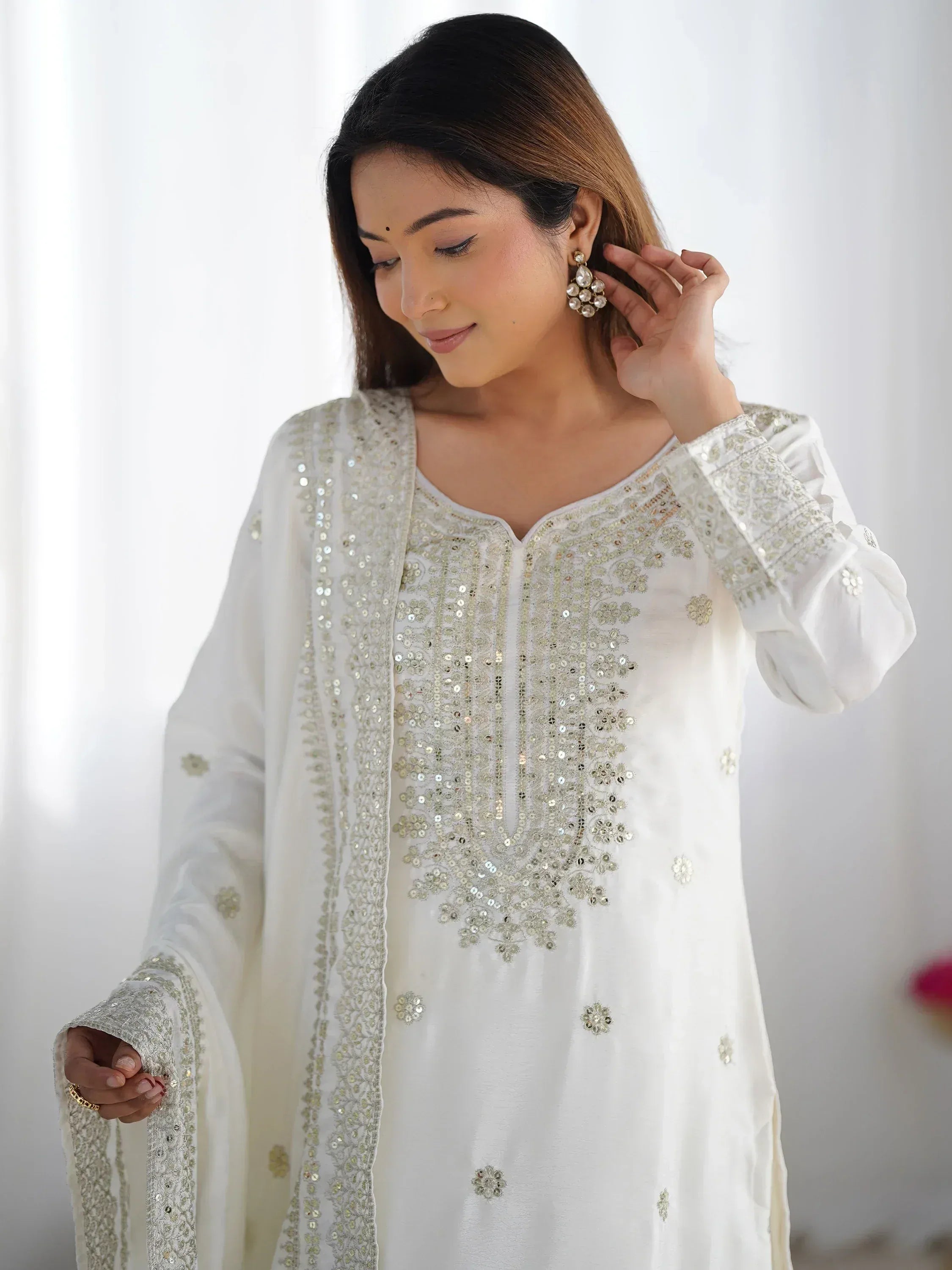 White embroidered kurta with sequin detailing, paired with matching dupatta for Indian ethnic wear